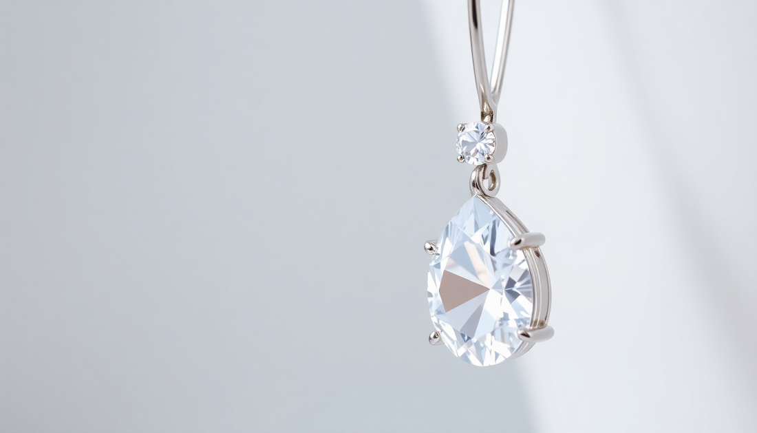 Close-up of a sterling silver necklace with a sparkling teardrop pendant demonstrating how to clean sterling silver jewellery