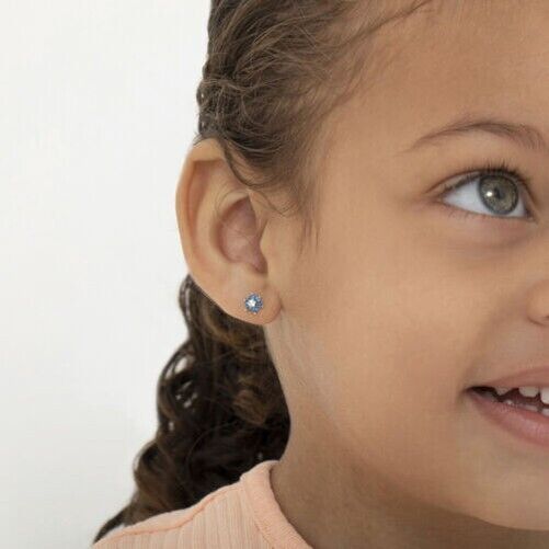 14k gold kids flower earrings worn by child with curly hair and blue eyes from In Season Jewellery