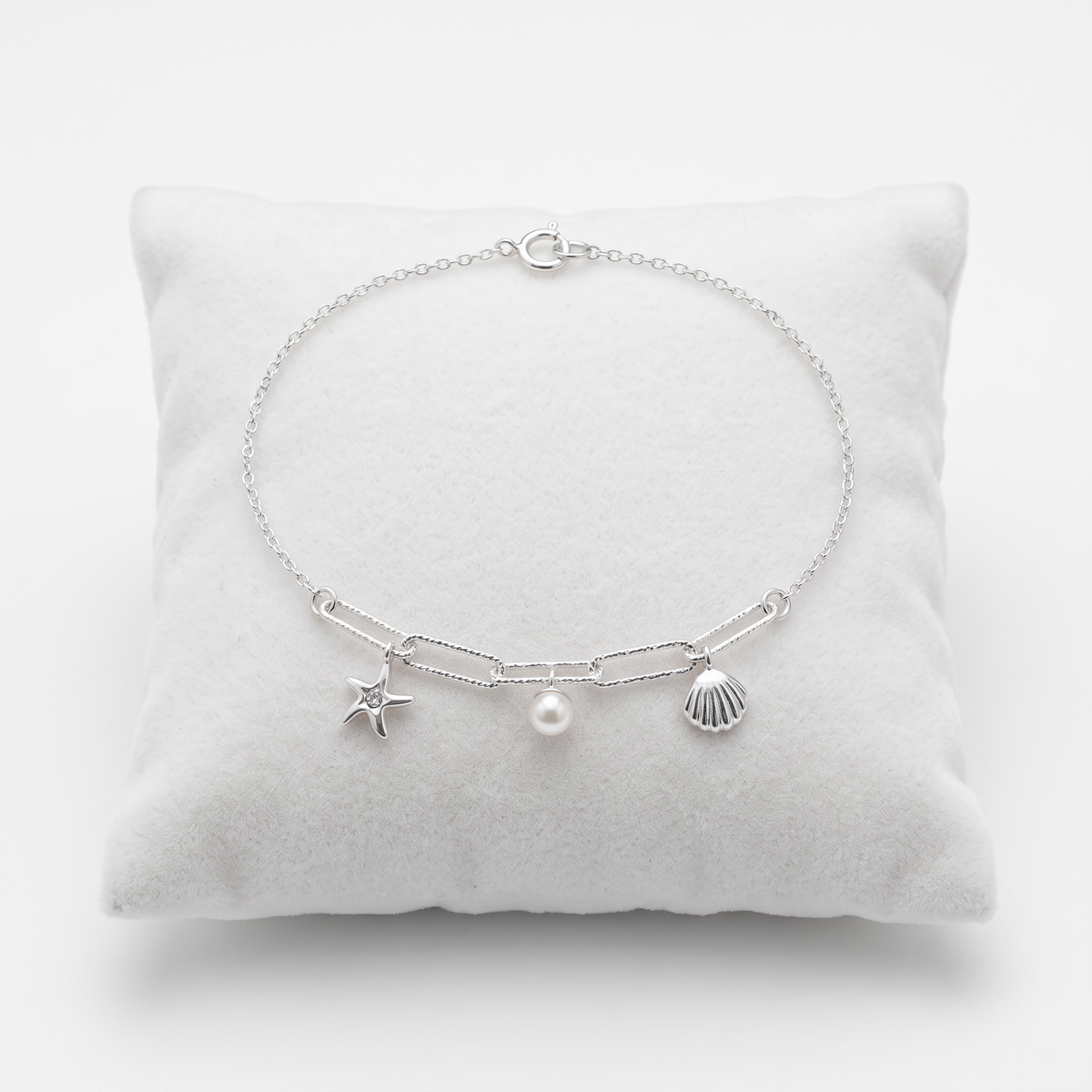 Sterling silver coastal-inspired bracelet featuring a created pearl and sparkling crystal
