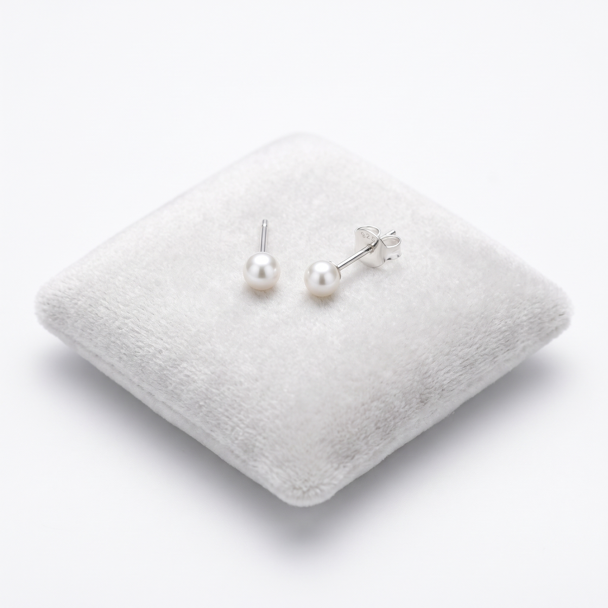 petite 3mm white pearl stud earrings for children On Jewellery Cushion
