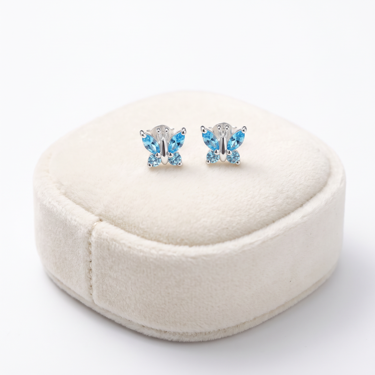 Sterling Silver Aquamarine CZ Butterfly Stud Earrings On Jewellery Cushion
