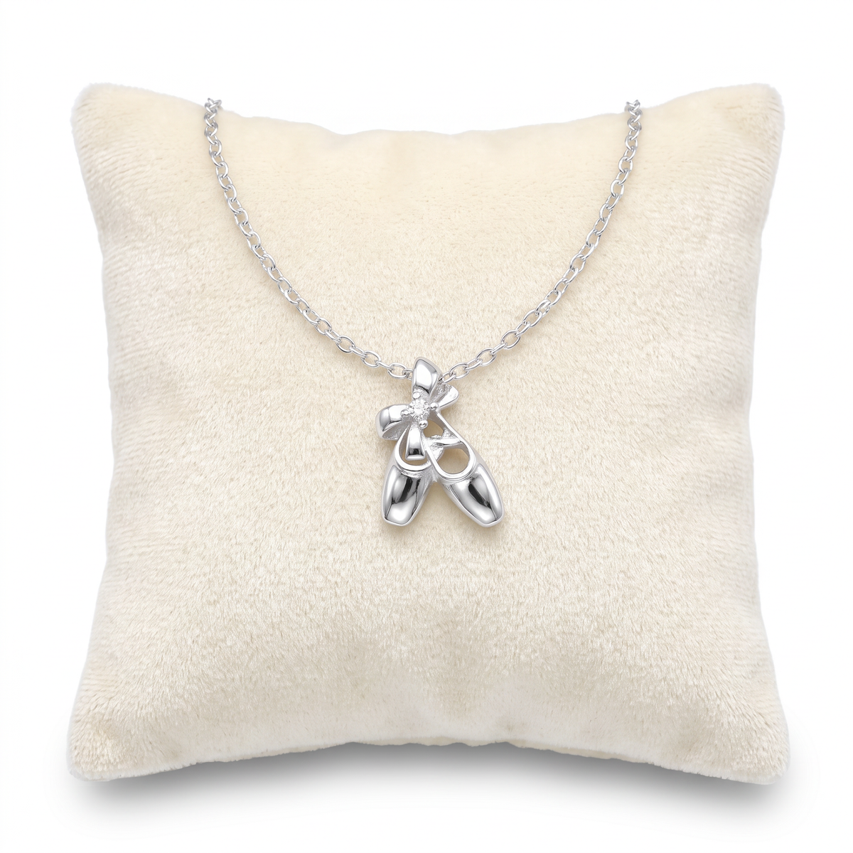 Girls 925 sterling silver ballet shoes charm necklace on Jewellery cushion