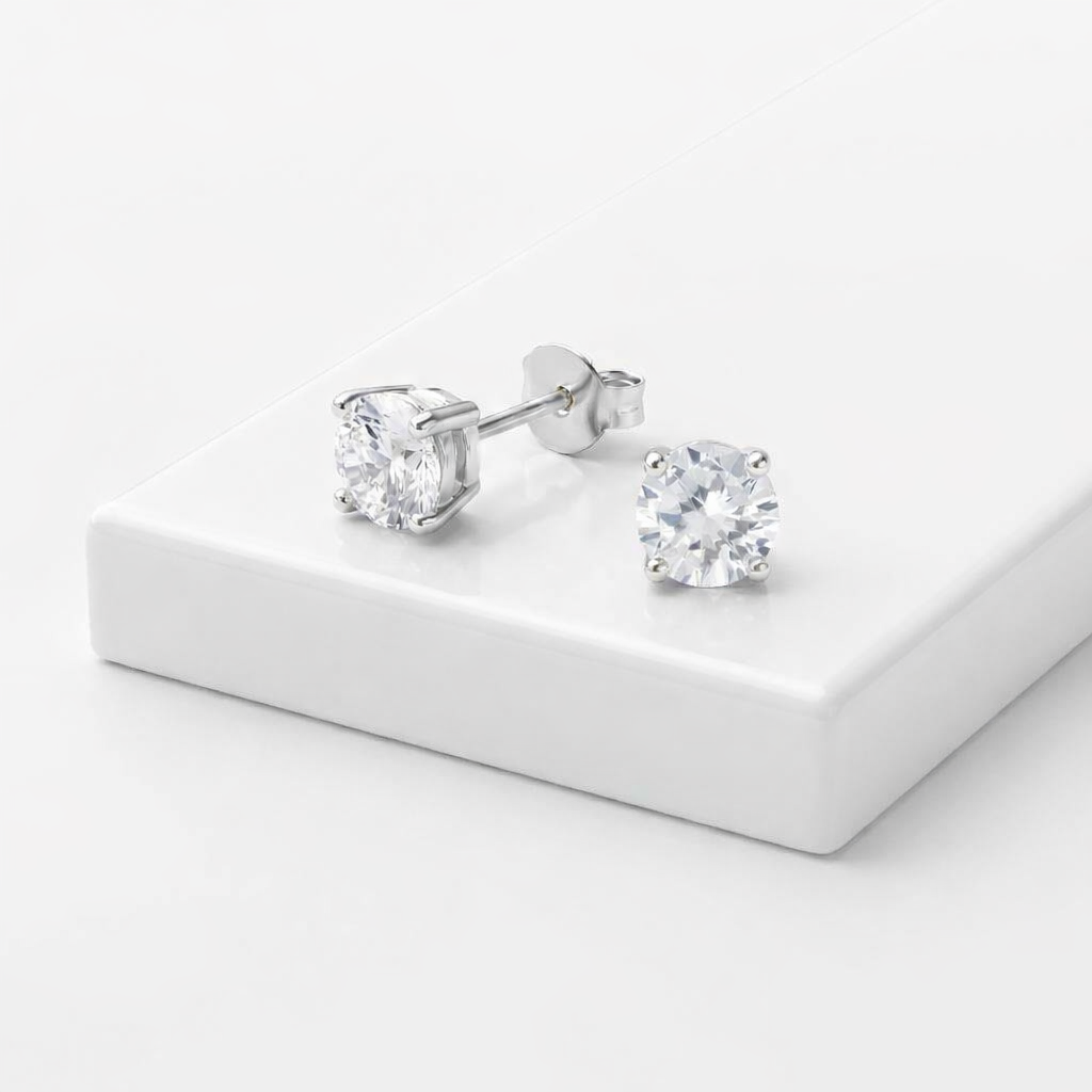 Diamond Stud Earrings featuring a classic design with sparkling stones.
