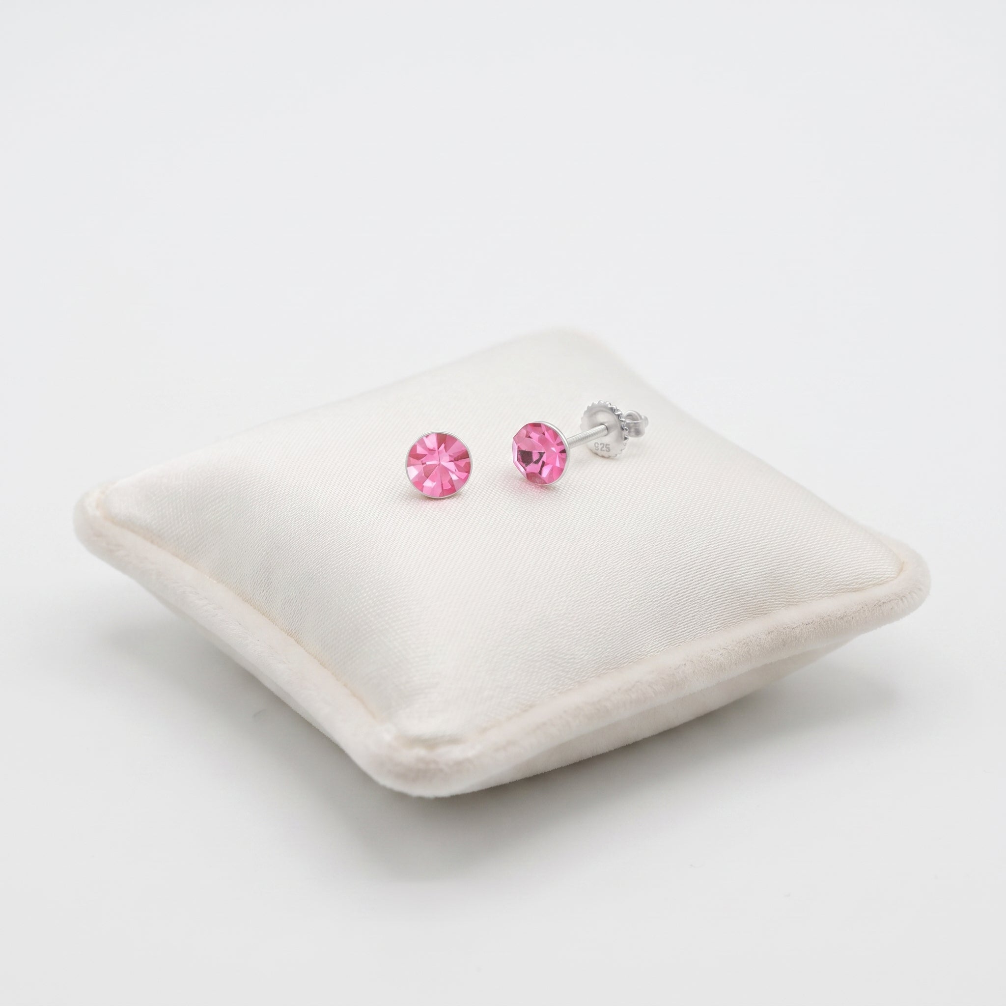 Sterling Silver Girls Pink Crystal Earrings on Jewellery Cushion