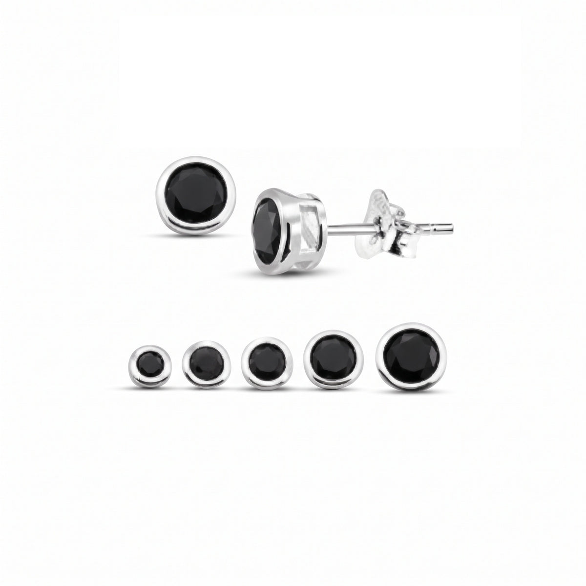 A set of round stud earrings with black centers and silver-toned settings, shown on a plain white background