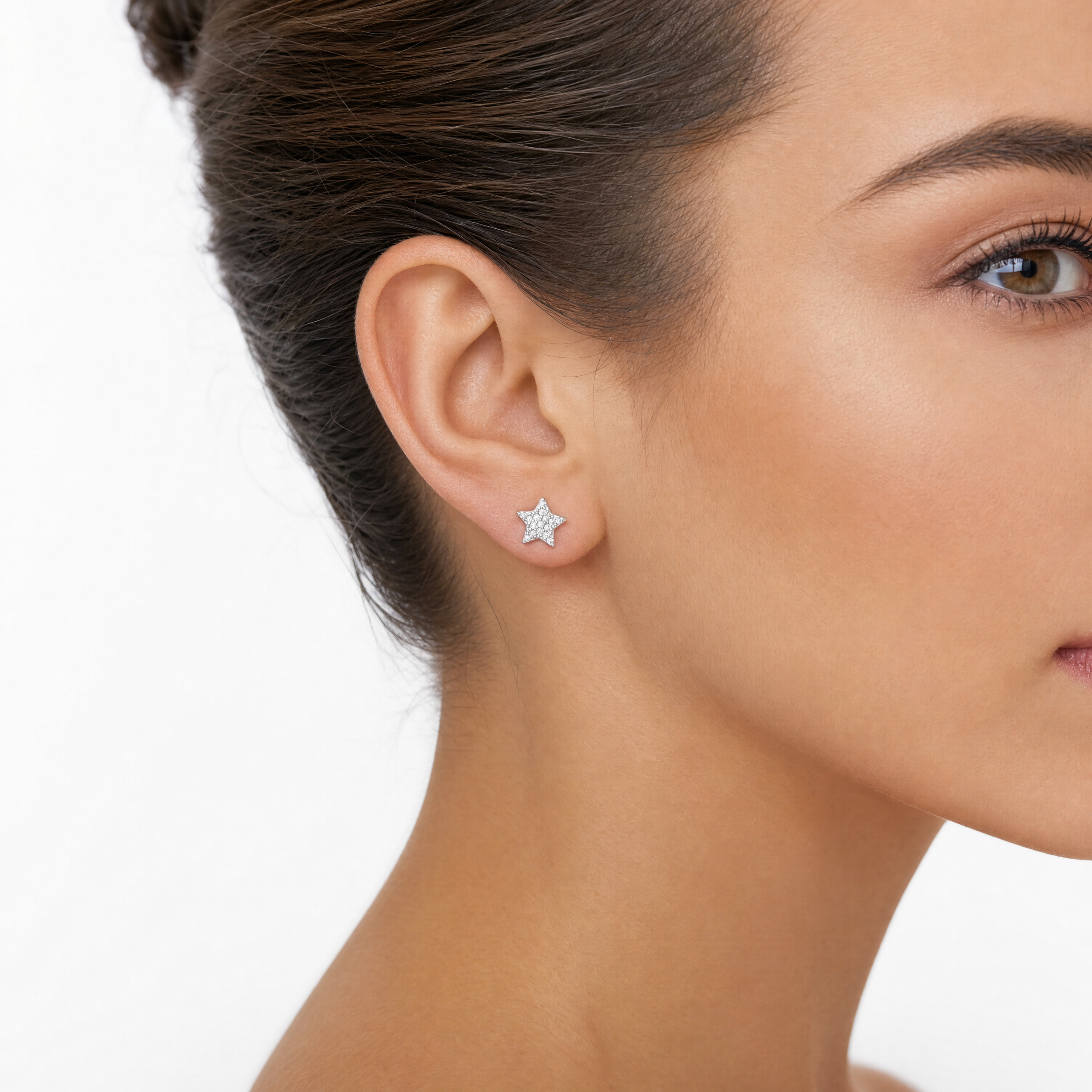 Sterling silver sparkling star stud earrings worn in ear