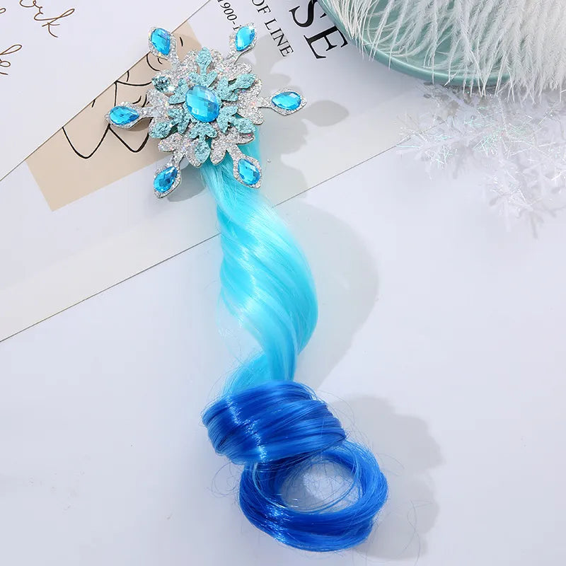 Blue synthetic hair extension for girls with a sparkling snowflake-shaped jewel clip by Melchior Jewellery