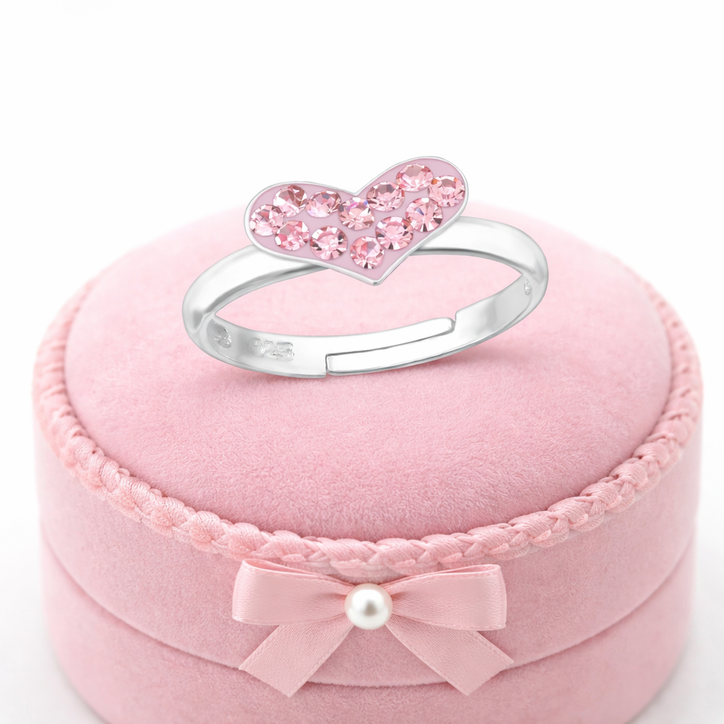 Girls pink crystal heart ring by Melchior Jewellery with sparkling pink crystals on silver band displayed on pink velvet box