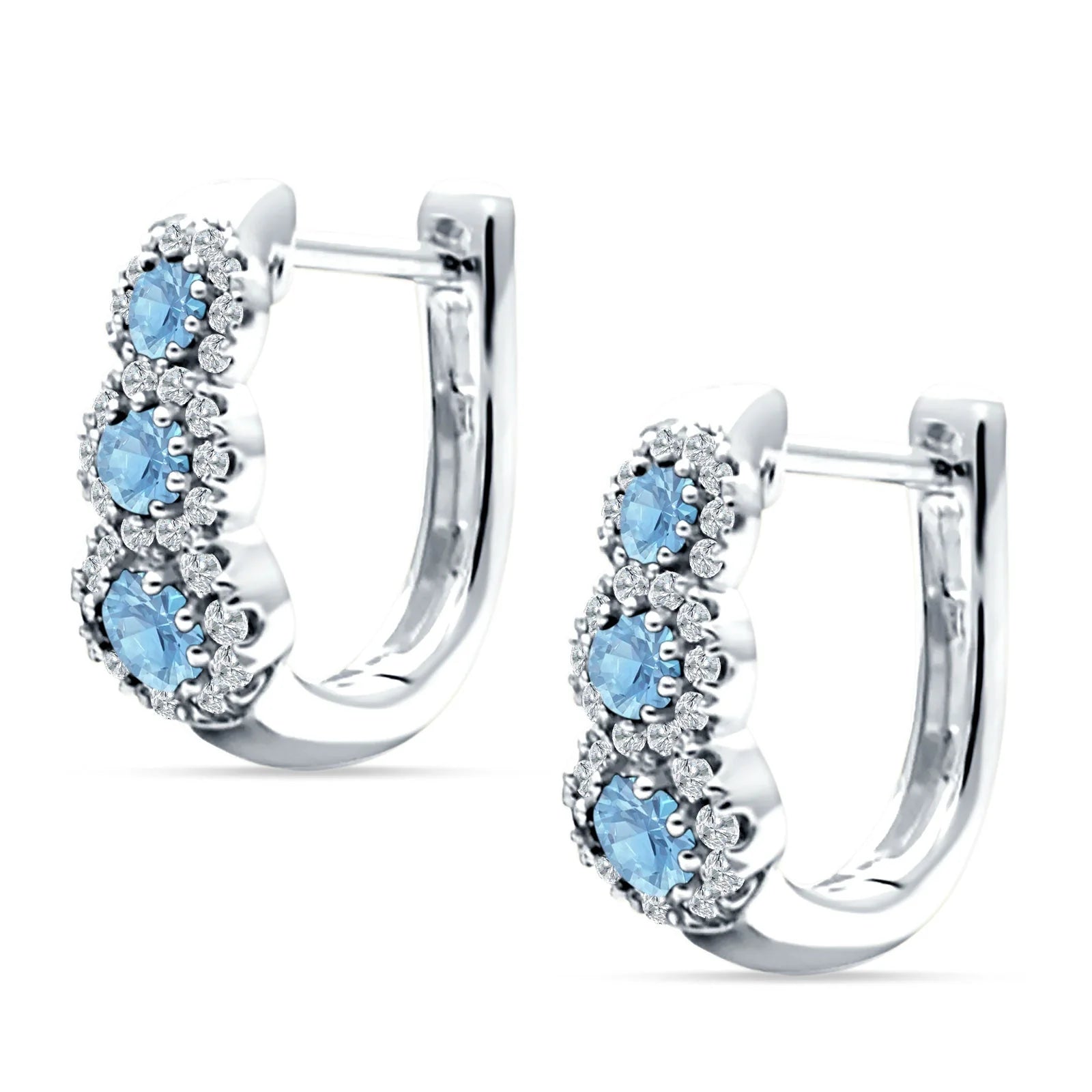 Melchior Jewellery silver huggie hoop earrings with three blue gemstones encircled by sparkling clear crystals