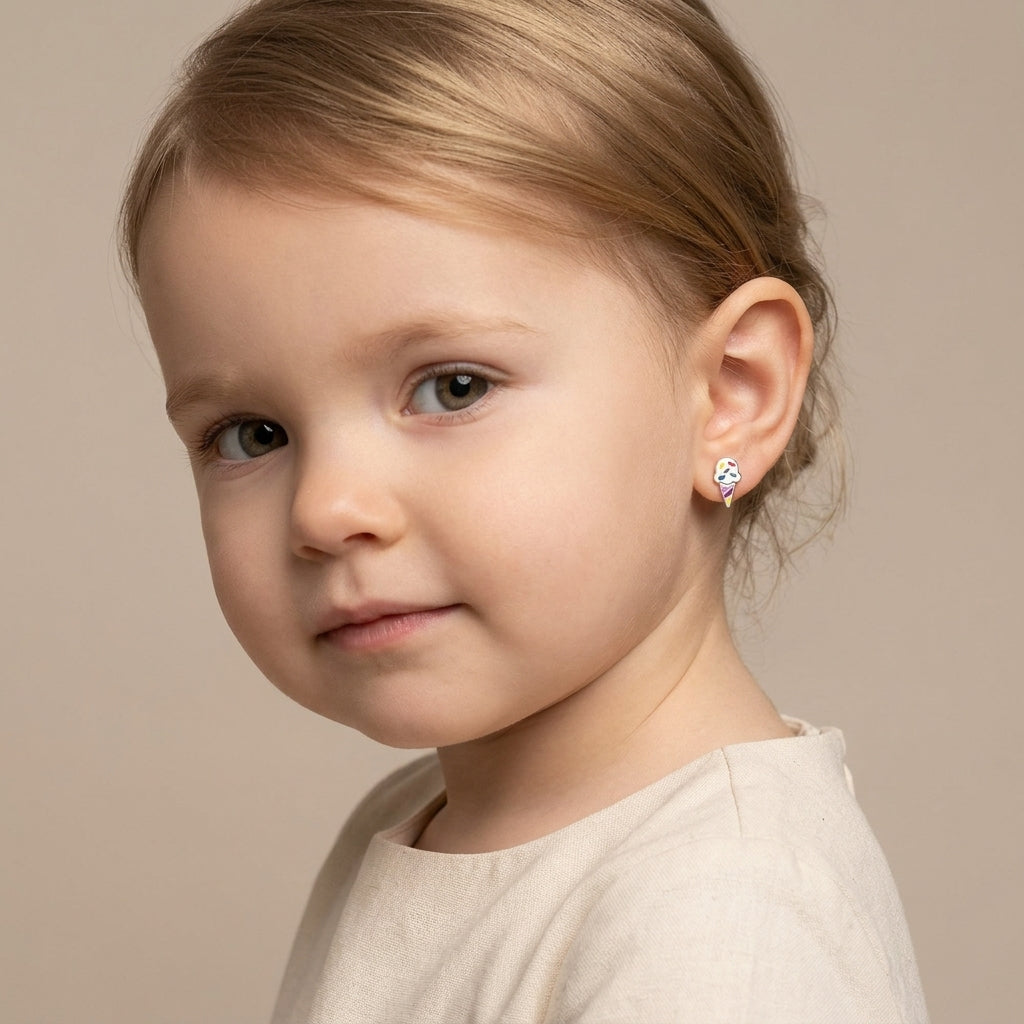 Young child wearing Silver Colourful Ice Cream Earrings by Melchior Jewellery with vibrant pink, blue, and green details