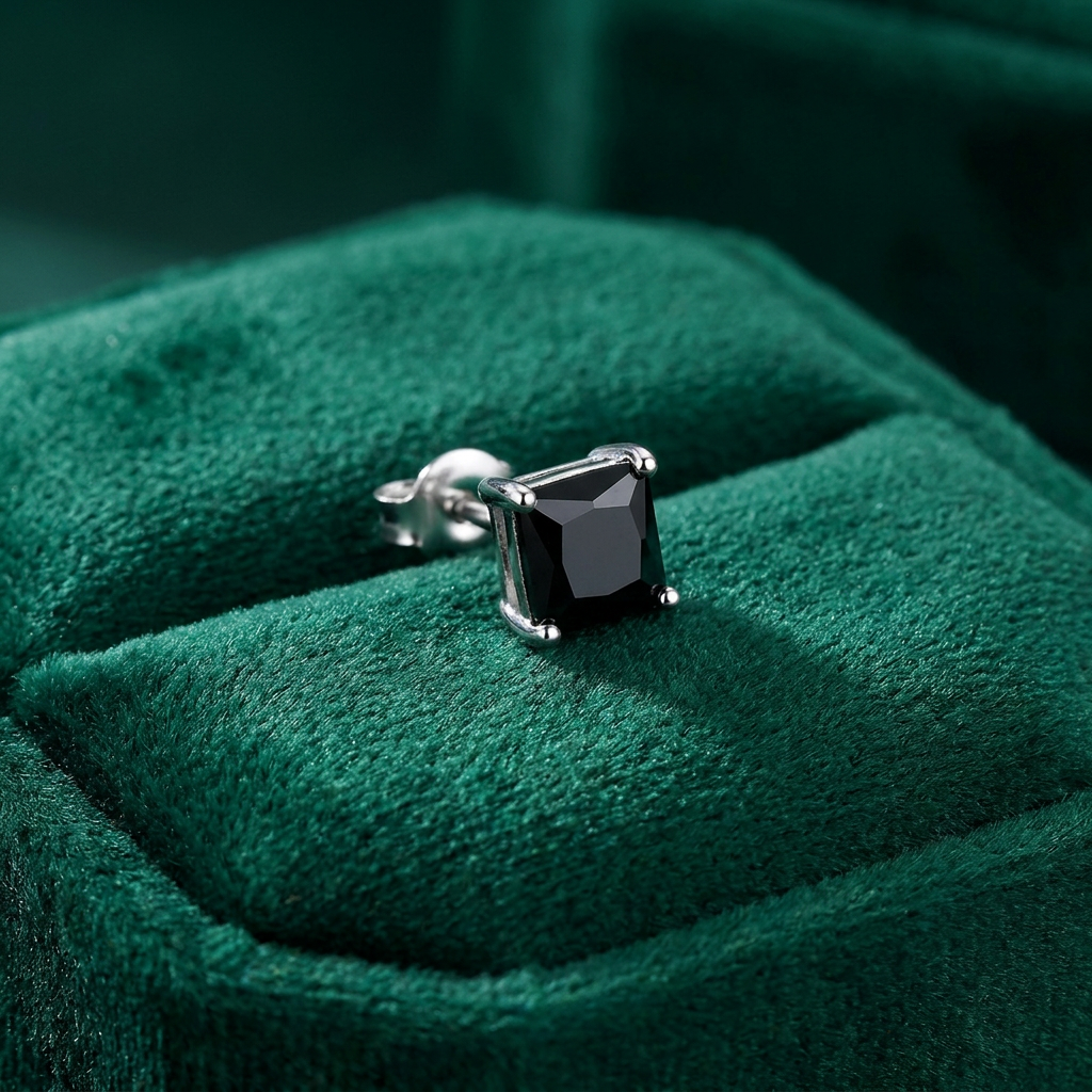 8mm black square cubic zirconia sterling silver stud earring worn on man's ear by Melchior Jewellery