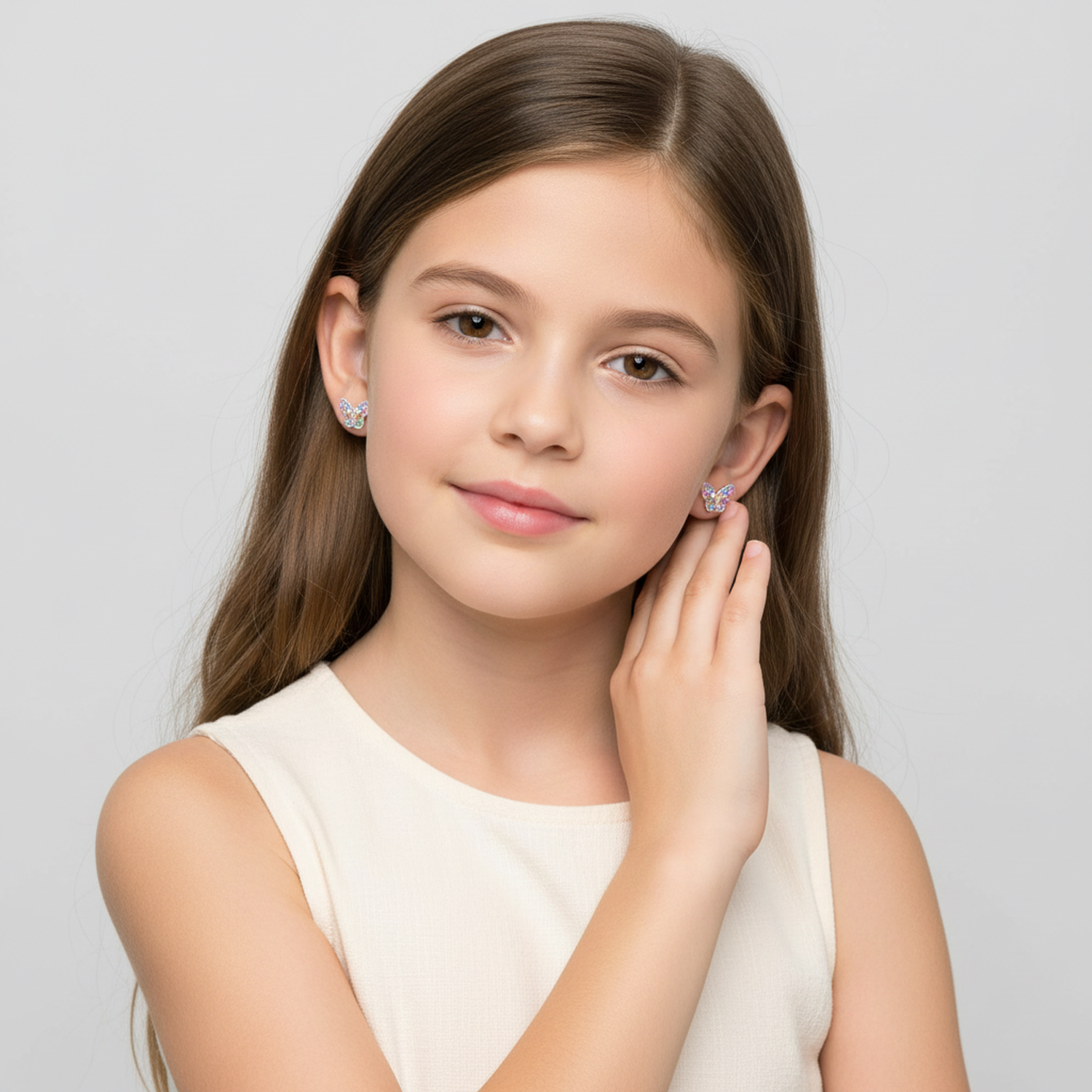 Melchior Jewellery hypoallergenic butterfly earrings for girls worn by young girl with long brown hair