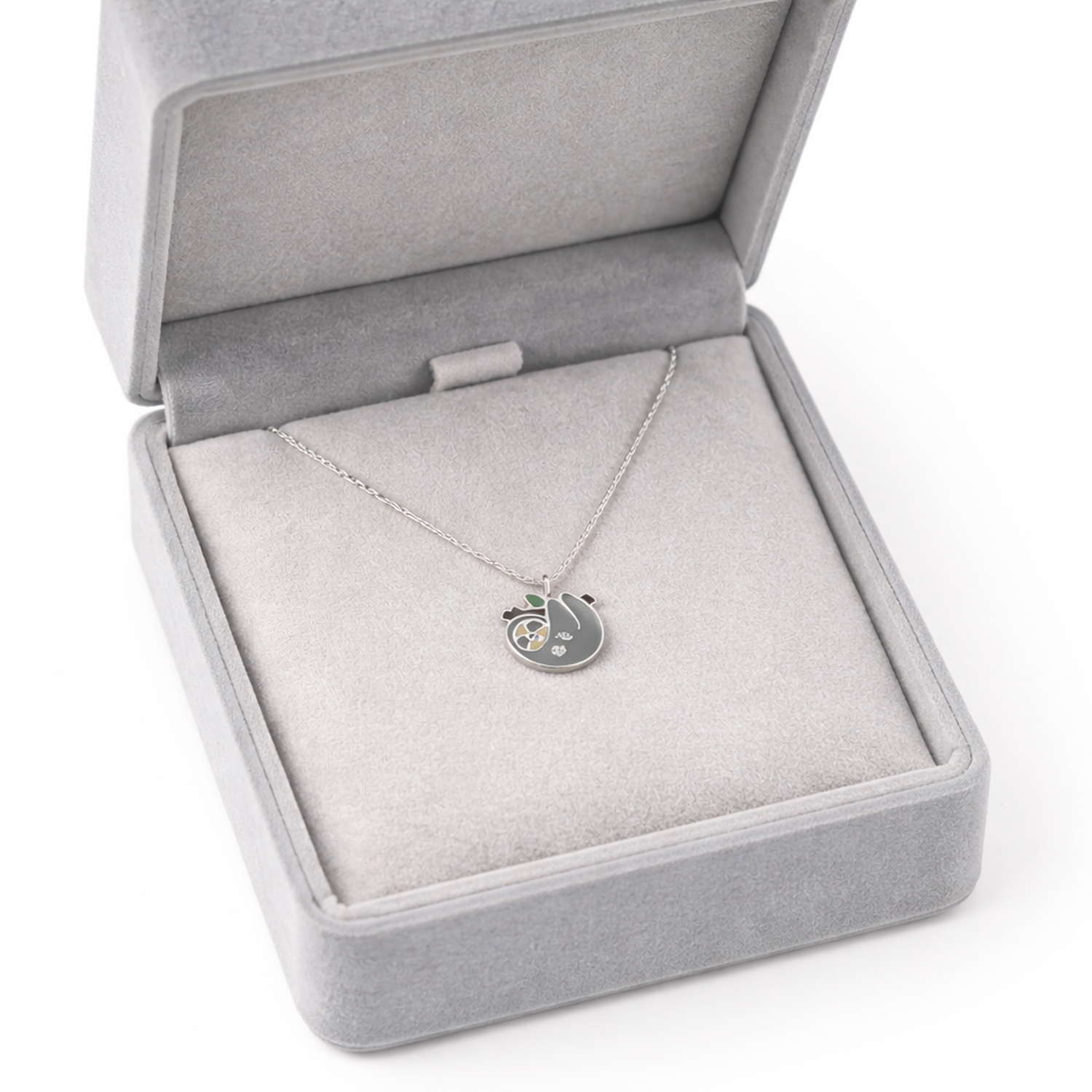 Sterling silver sloth necklace for kids with a cute pendant in a grey jewellery box
