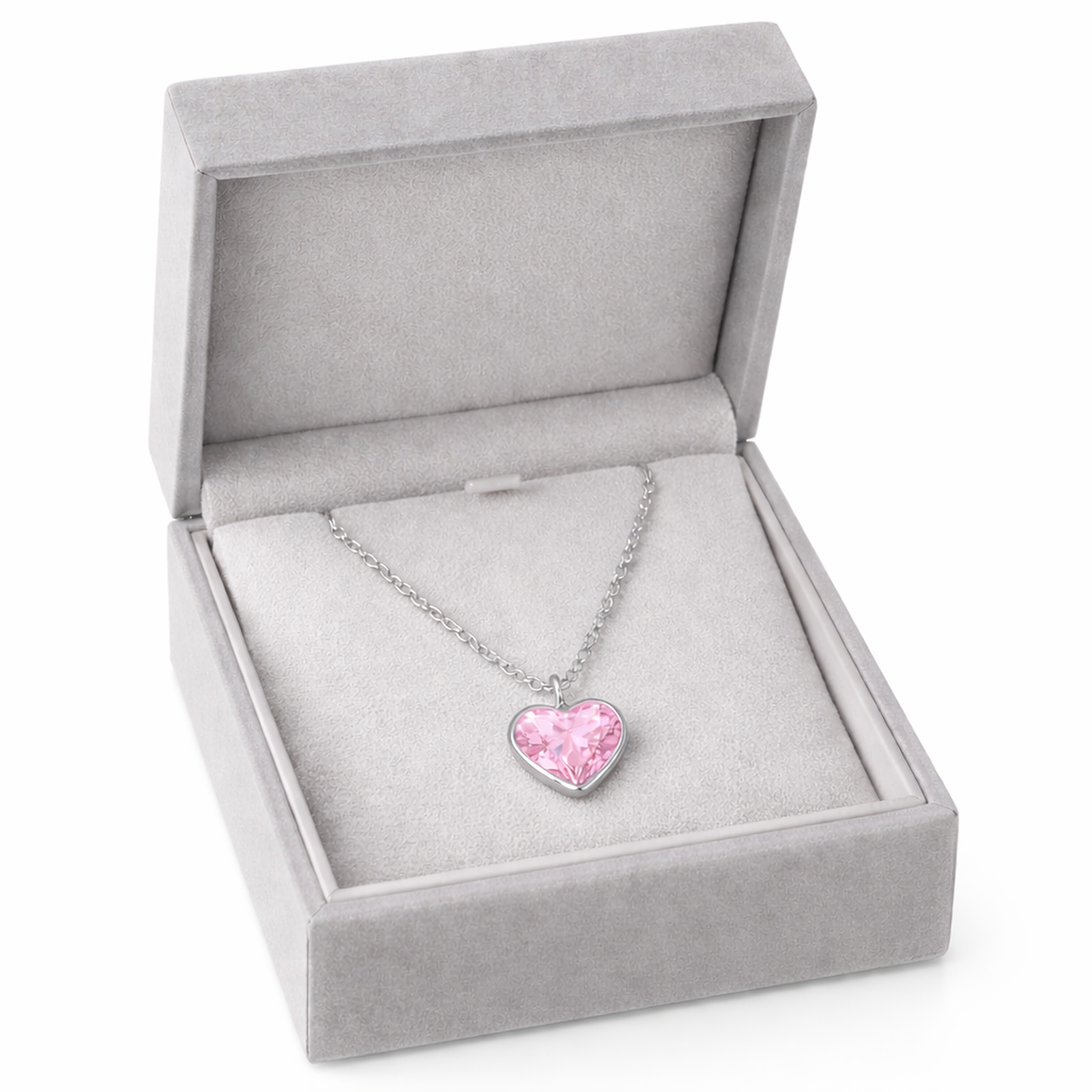 Sterling silver pink heart necklace for children displayed in a grey jewellery box by Melchior Jewellery
