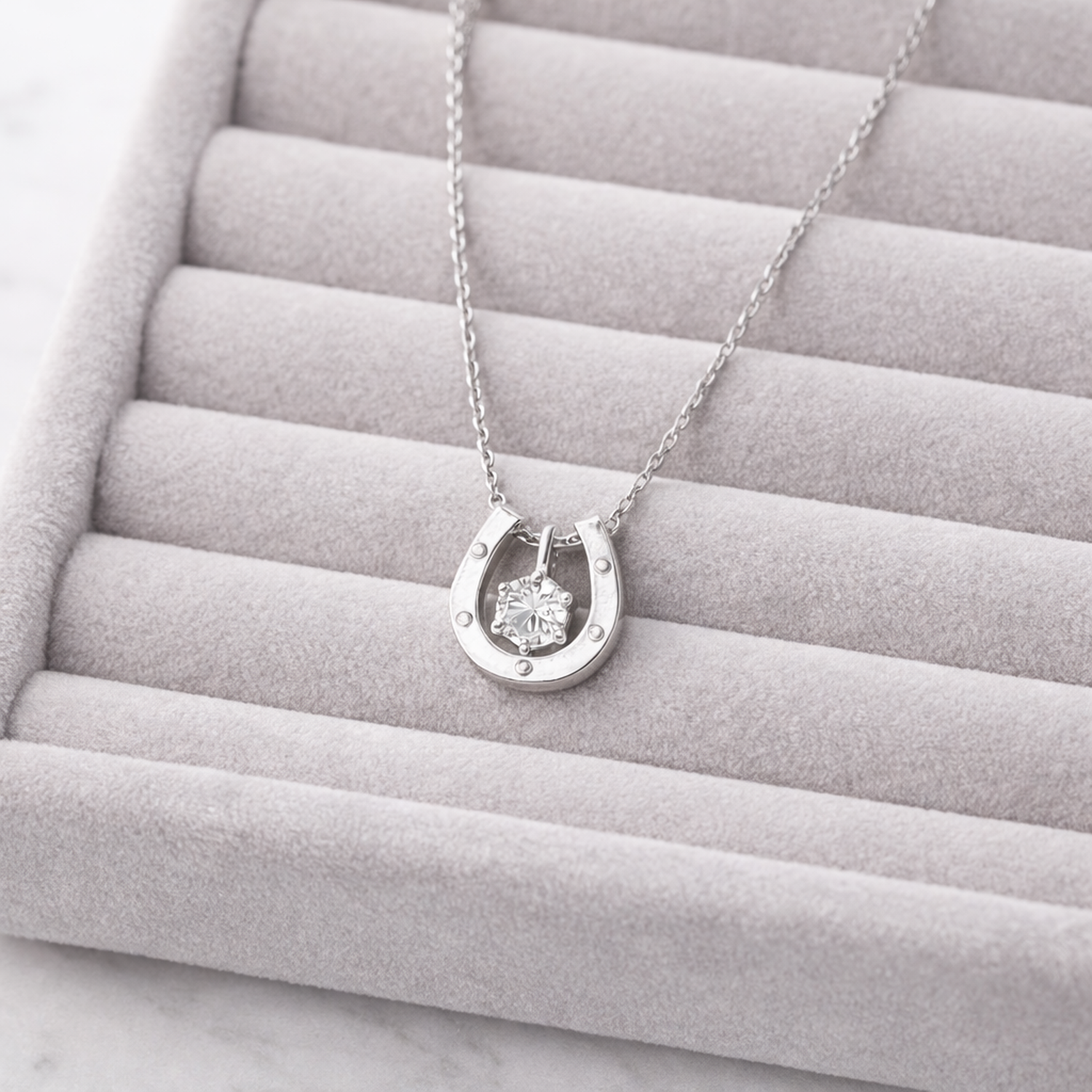 Melchior Jewellery sterling silver horseshoe necklace with a sparkling centre stone on a delicate chain
