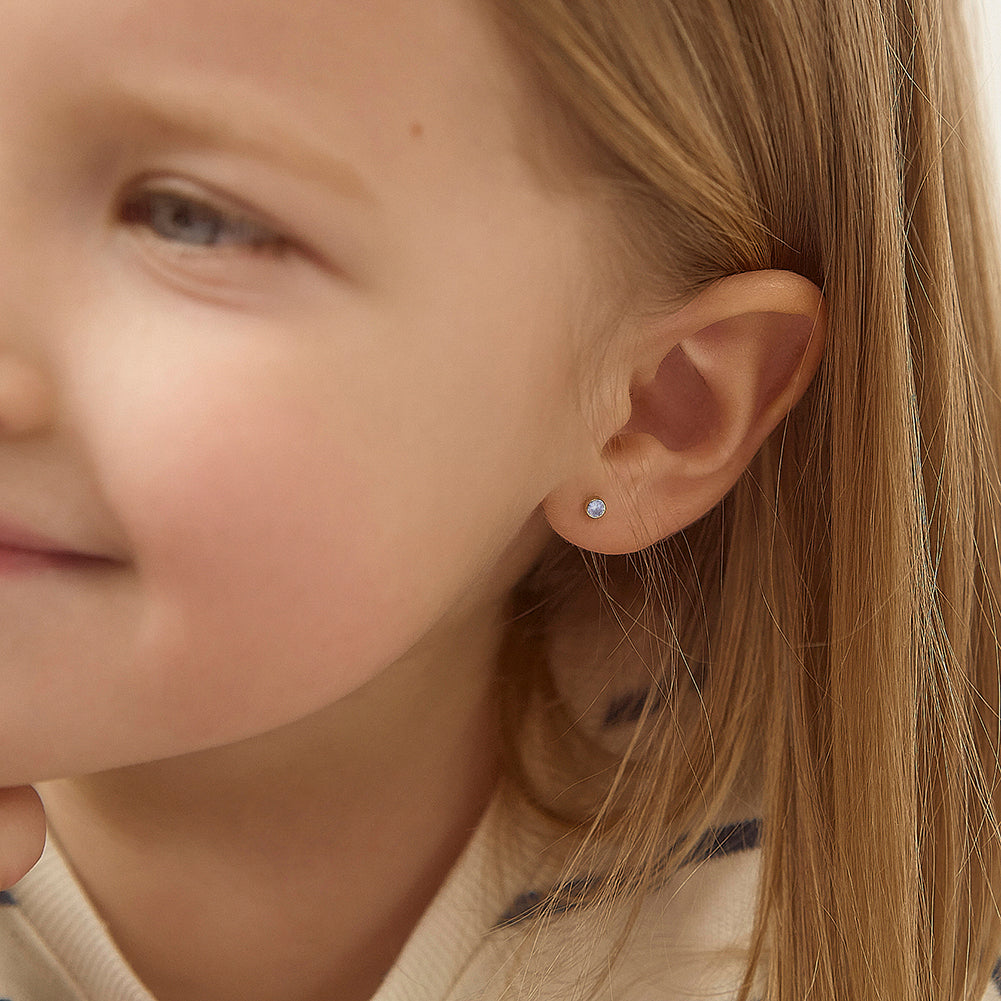 14k gold June birthstone earrings for girls worn by a child showing delicate jewellery from In Season Jewellery