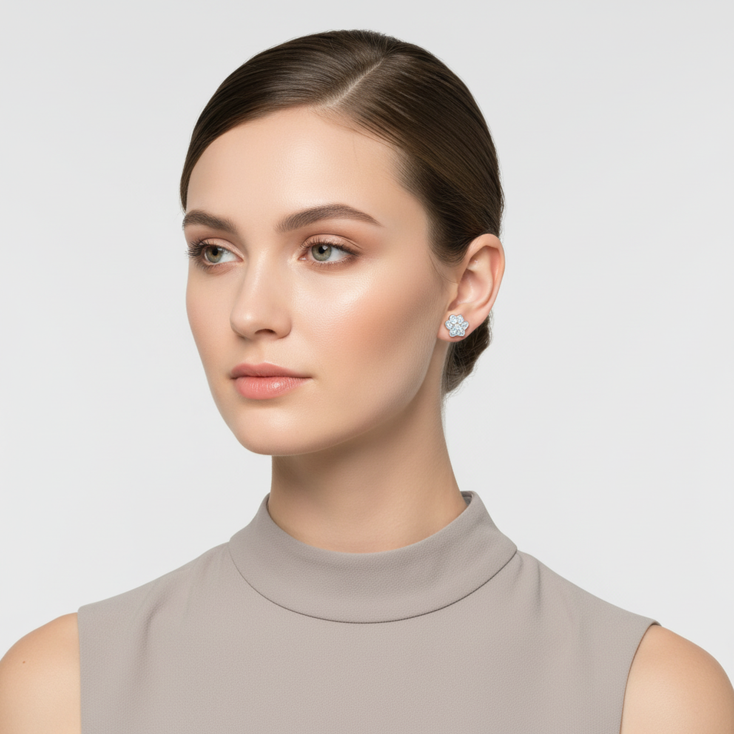 Elegant diamond stud earrings showcased on a model with a neutral background.