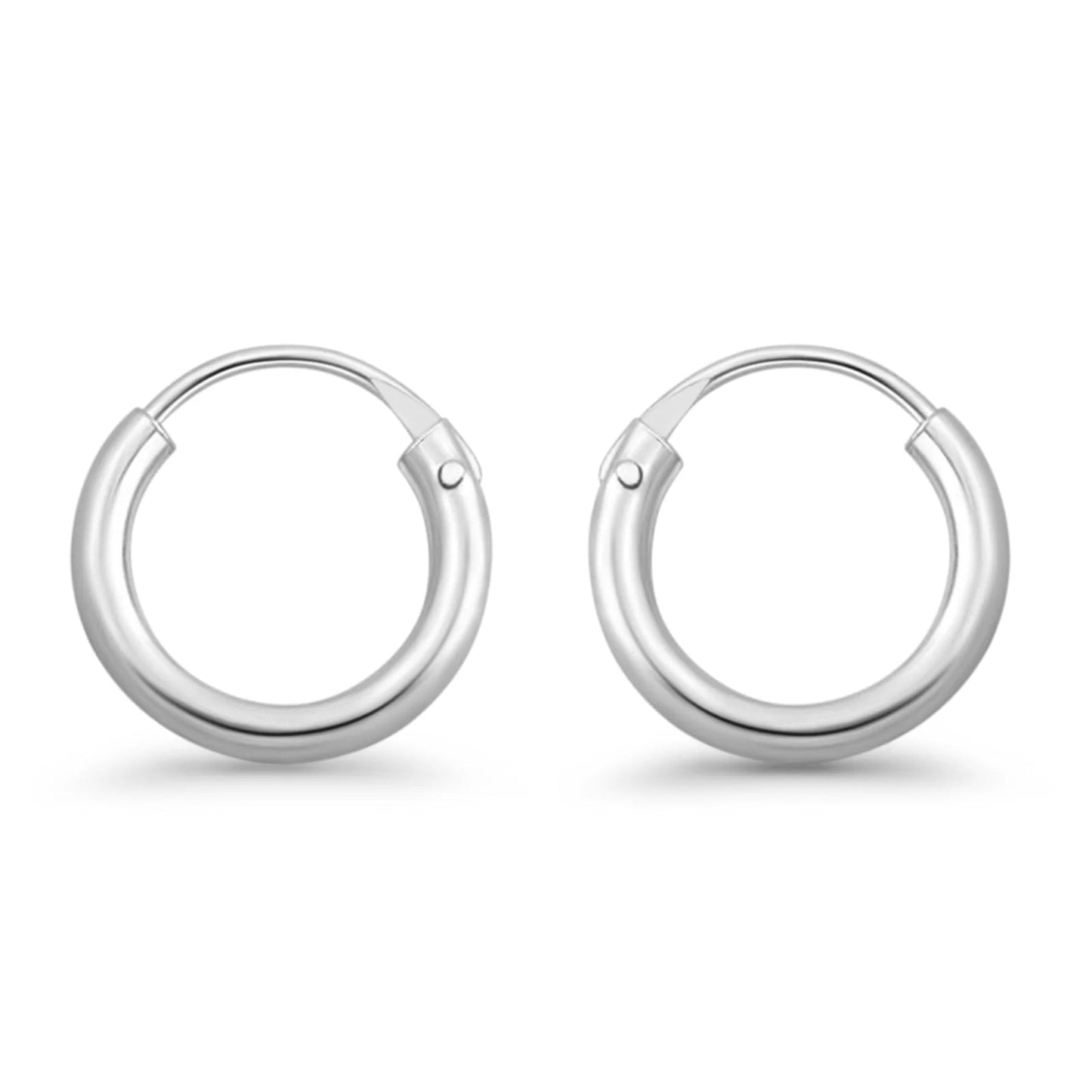 Melchior Jewellery womens earrings pair of polished 2mm thick rhodium plated hoops small hinged silver design
