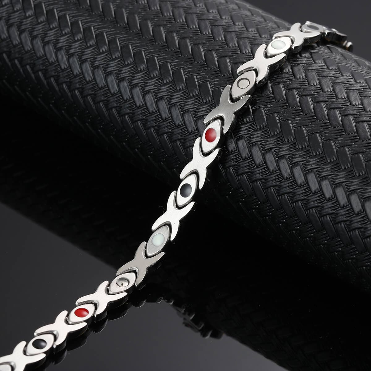 Melchior Jewellery 4in1 healing magnetic bracelet in silver with coloured magnetic elements on black textured background