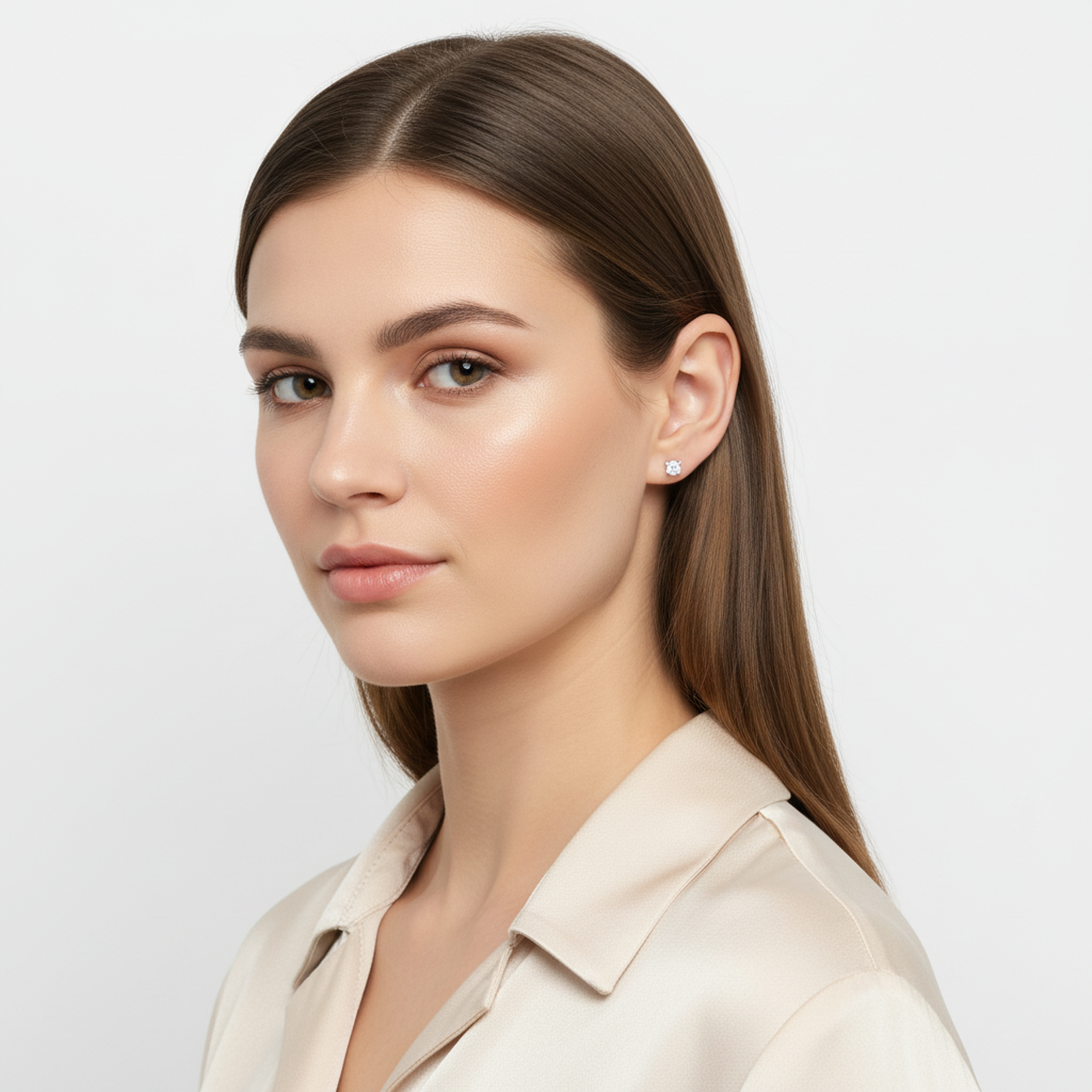 Woman wearing 4mm round cubic zirconia earrings from Melchior Jewellery in a neutral blouse