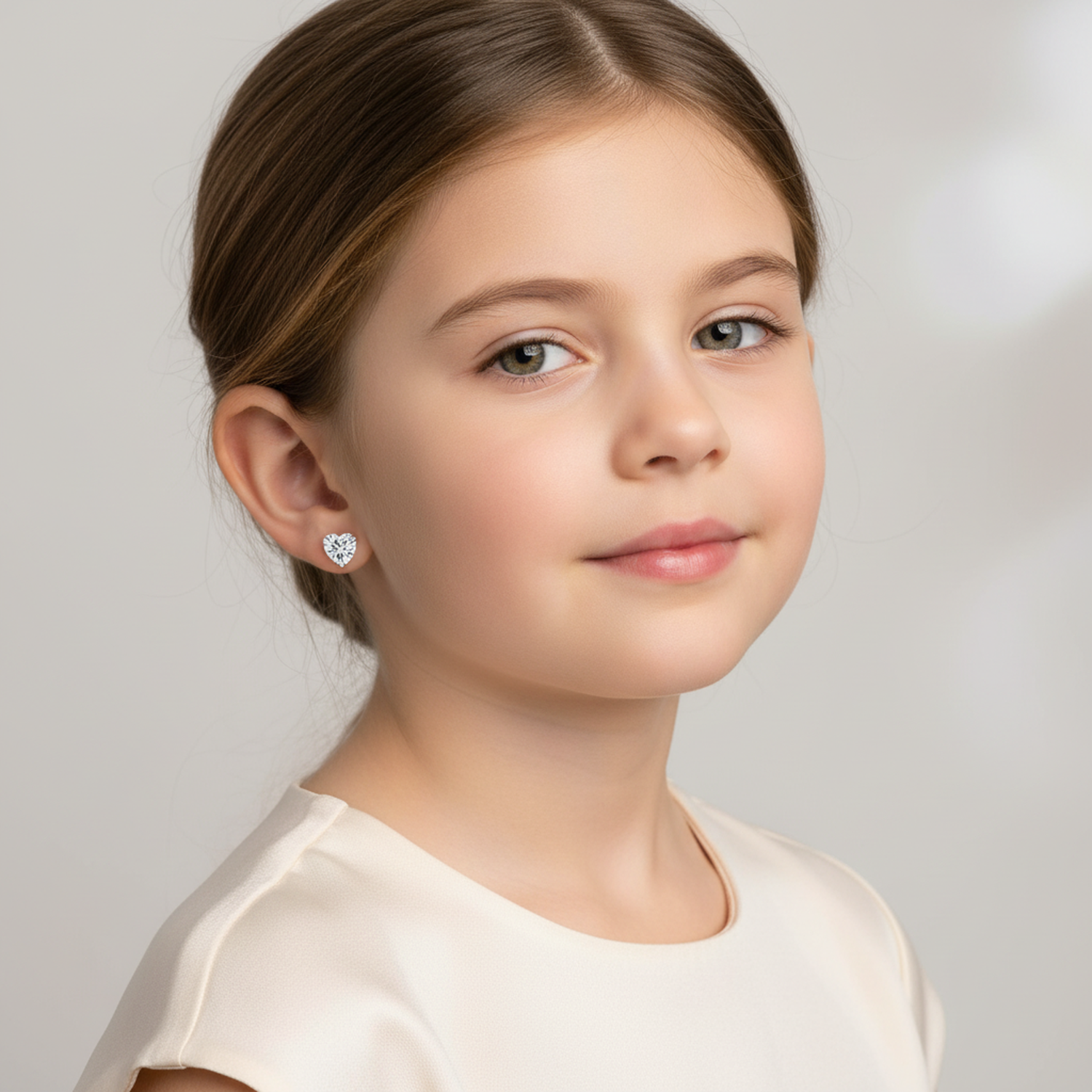 sterling silver 6mm CZ screw back earrings for girls worn by young girl with cream dress