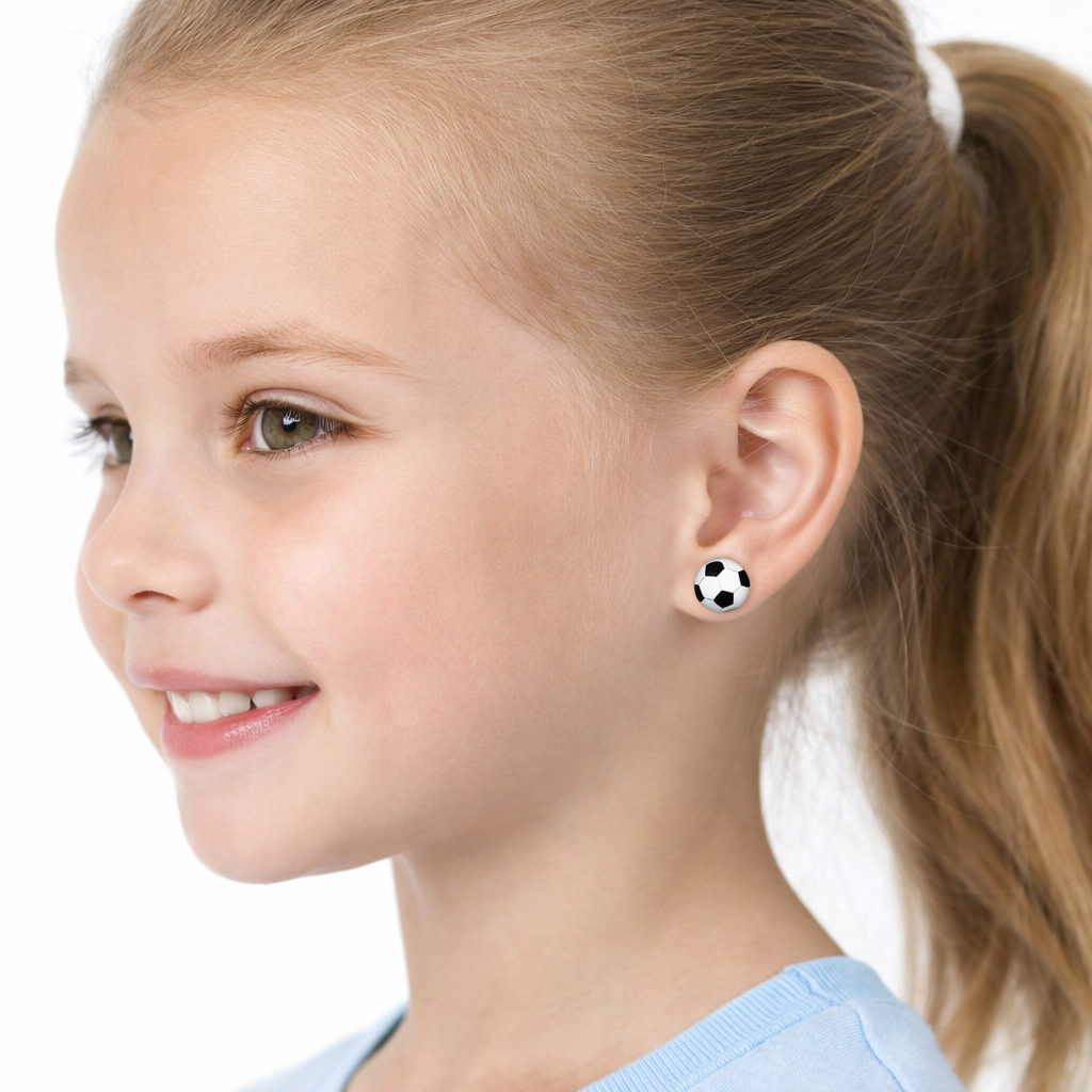 925 silver football stud earrings for kids worn by young girl with blonde hair and blue top