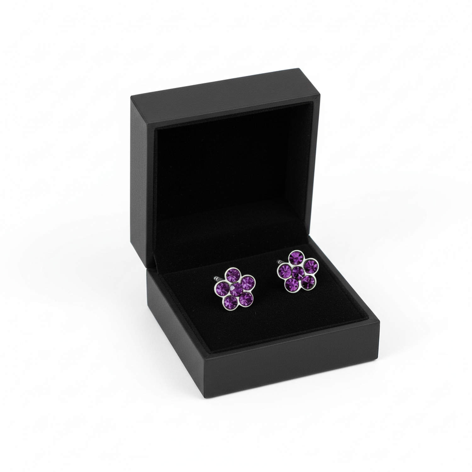 Amethyst flower stud earrings for girls displayed in a black jewellery box by Melchior Jewellery