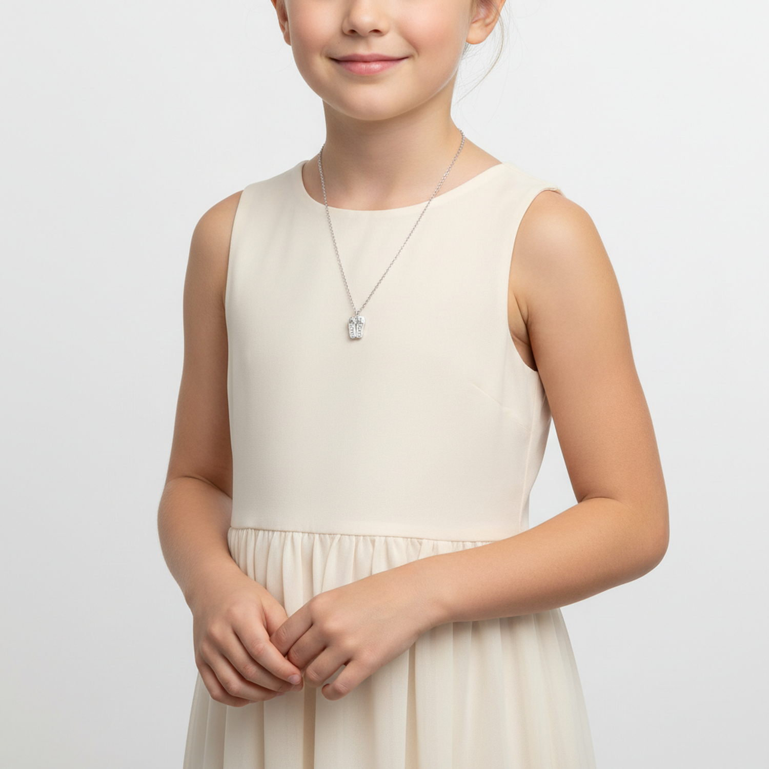 Melchior Jewellery ballet shoes charm necklace for children worn by girl in cream dress
