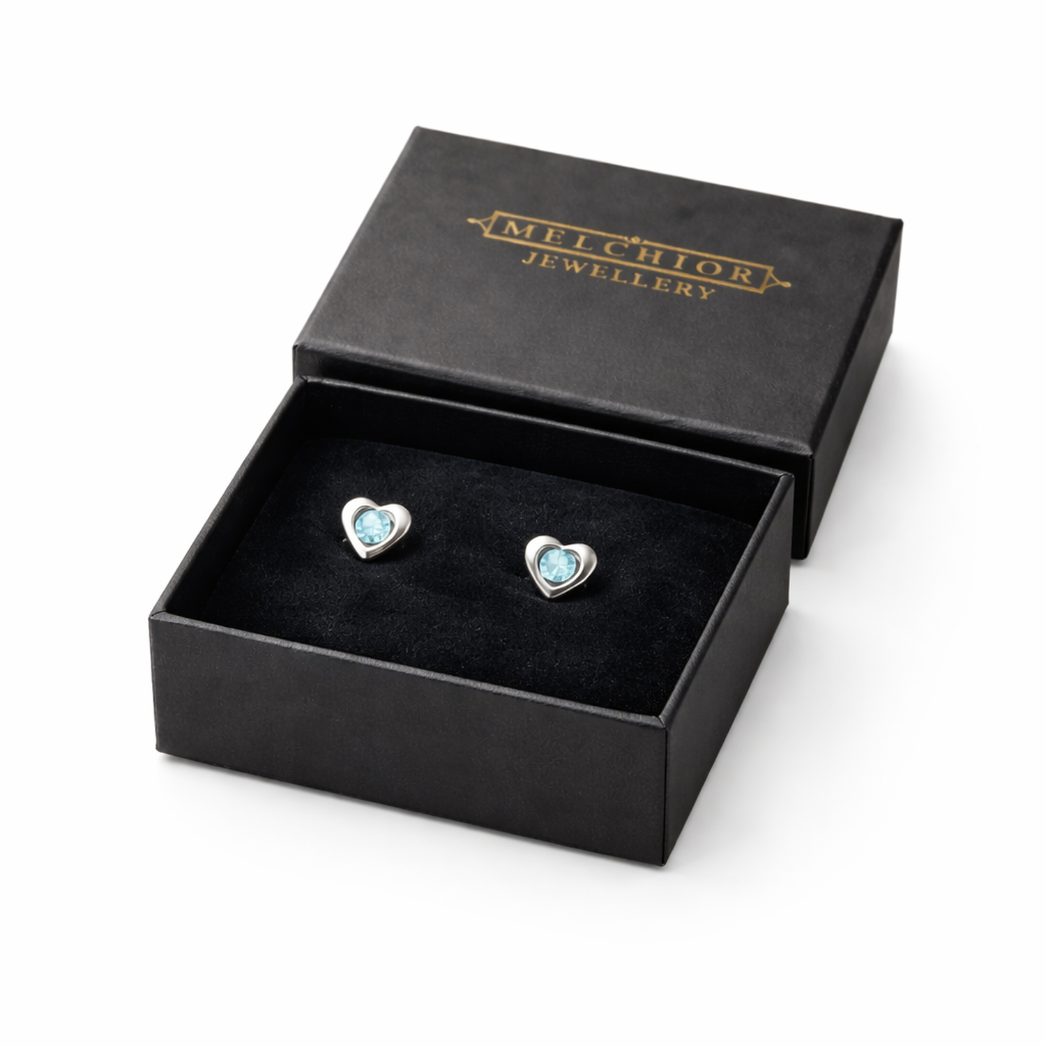 Blue crystal heart stud earrings for kids presented in Melchior Jewellery black gift box