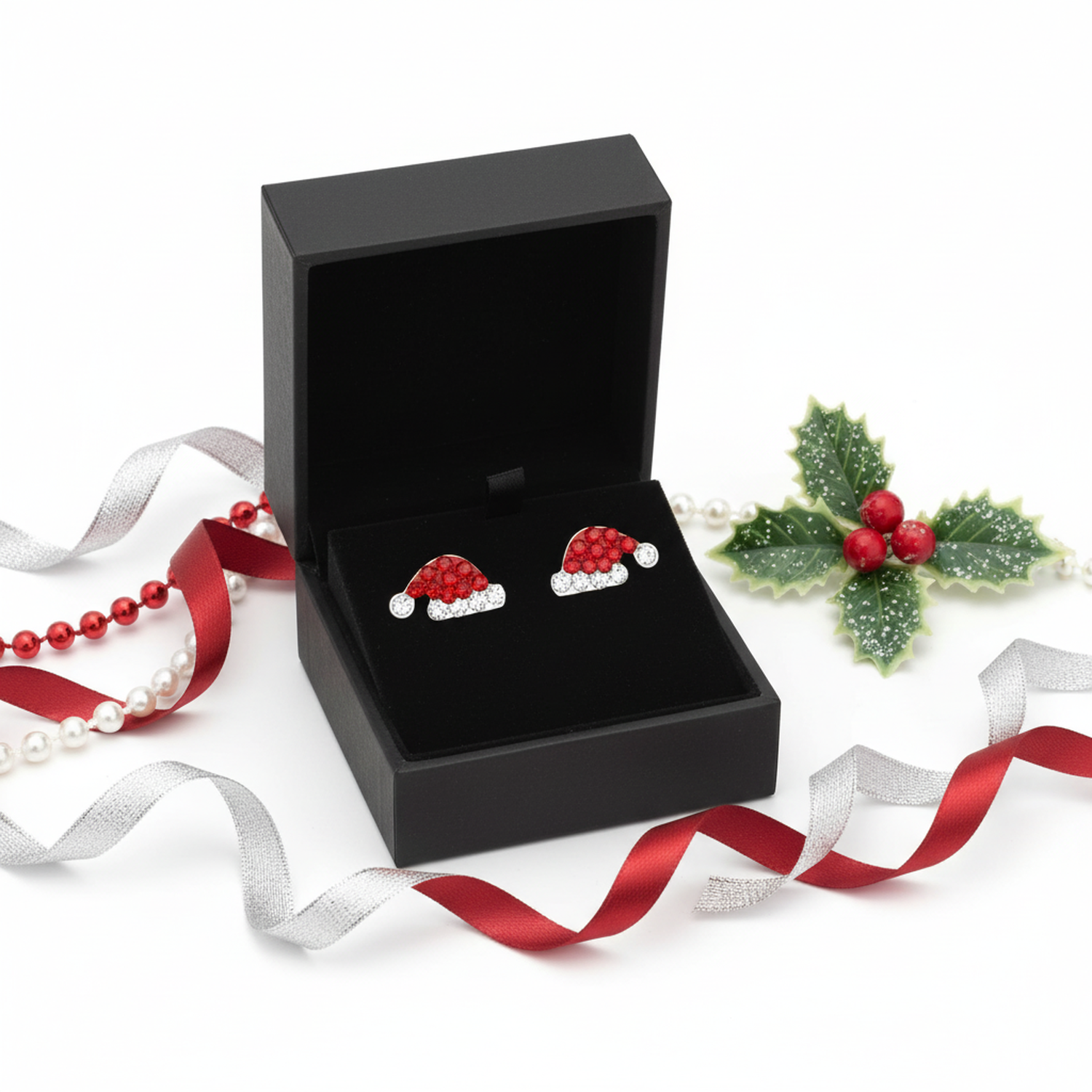 Melchior Jewellery Christmas Hat Earrings with red and white crystals in black gift box with festive ribbons and holly decoration