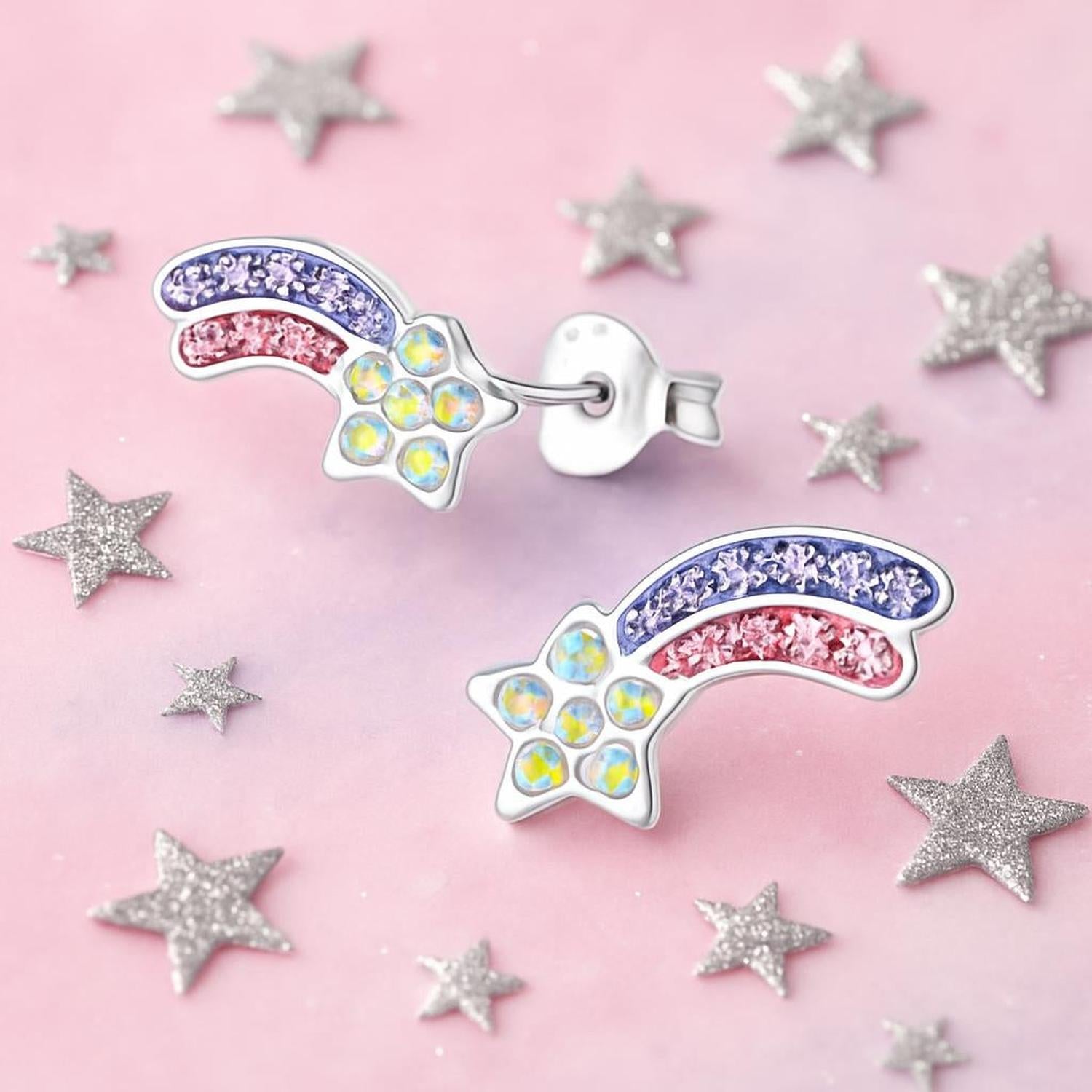 Colourful crystal star stud earrings for kids featuring iridescent yellow stones and purple and pink crystal trails