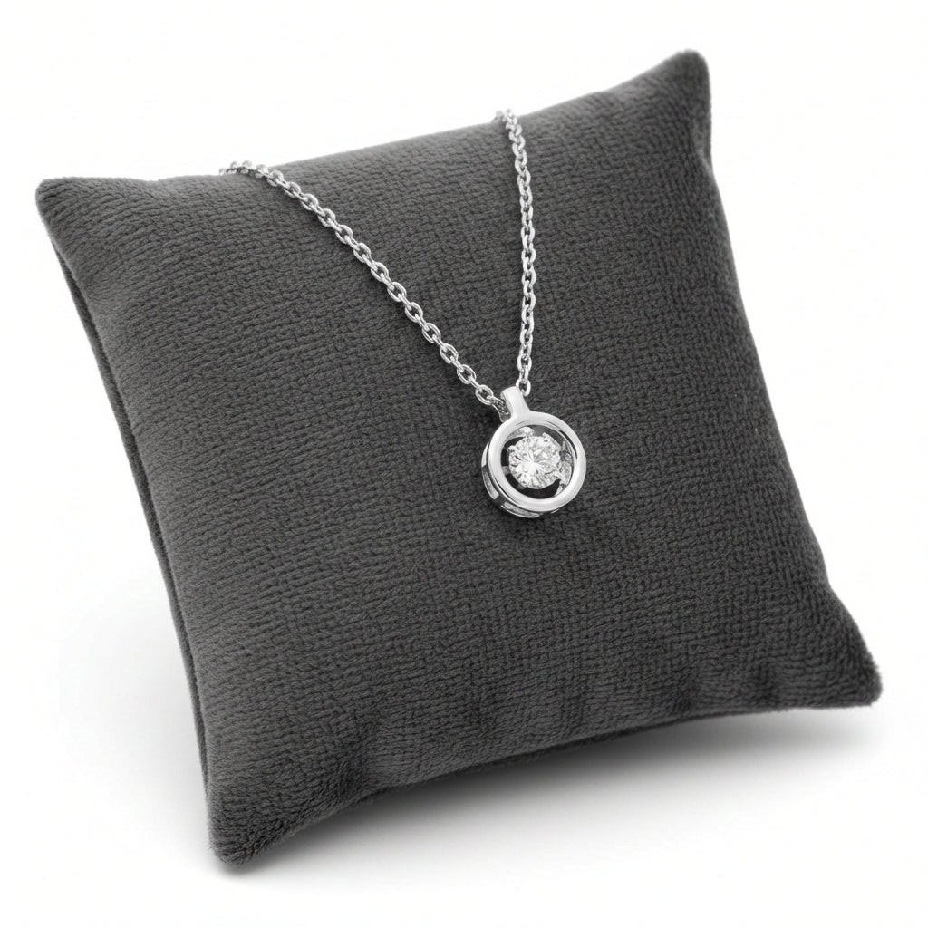 Crystal halo pendant for woman necklace by Melchior Jewellery displayed on a black cushion