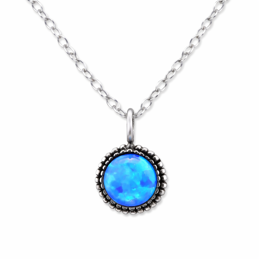 Elegant blue gemstone pendant necklace from Melchior Jewellery with silver chain and detailed setting