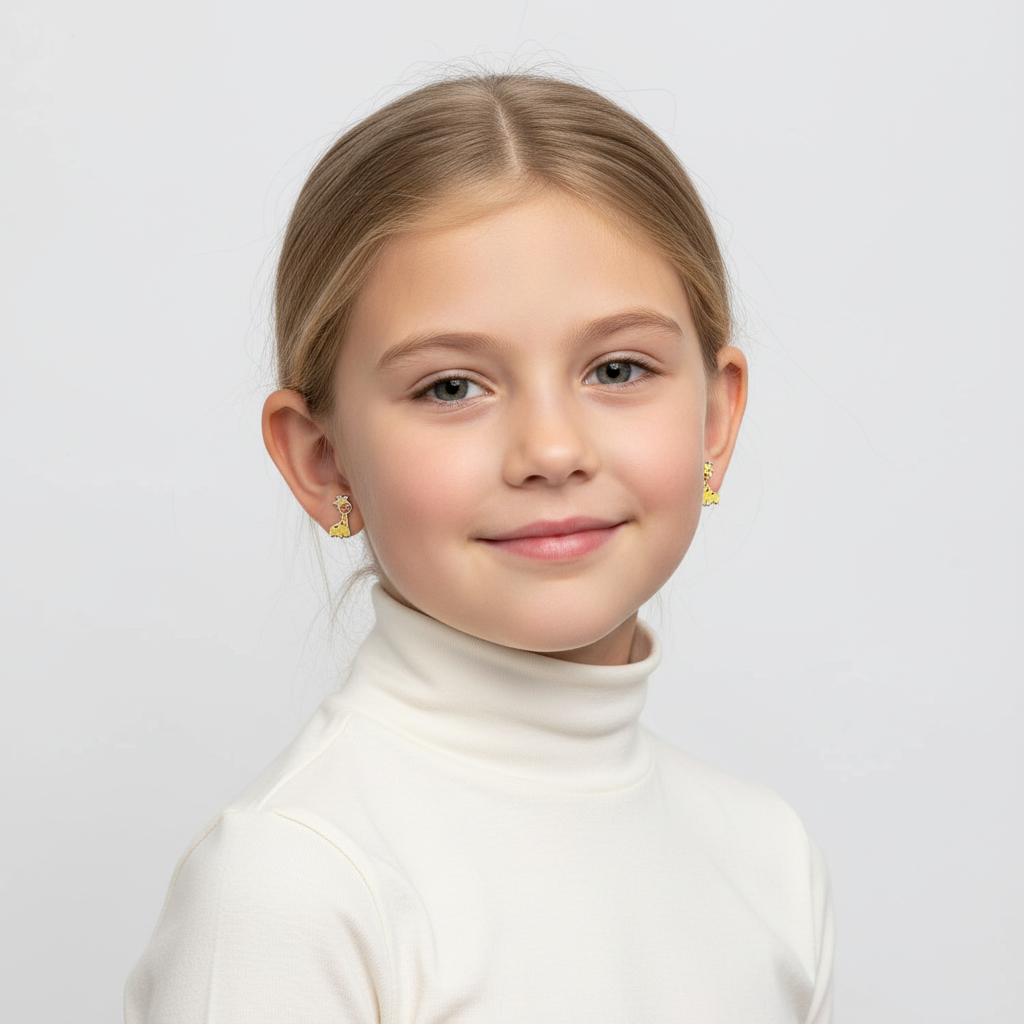 Young girl wearing Melchior Jewellery giraffe shaped earrings for children in yellow gold tone