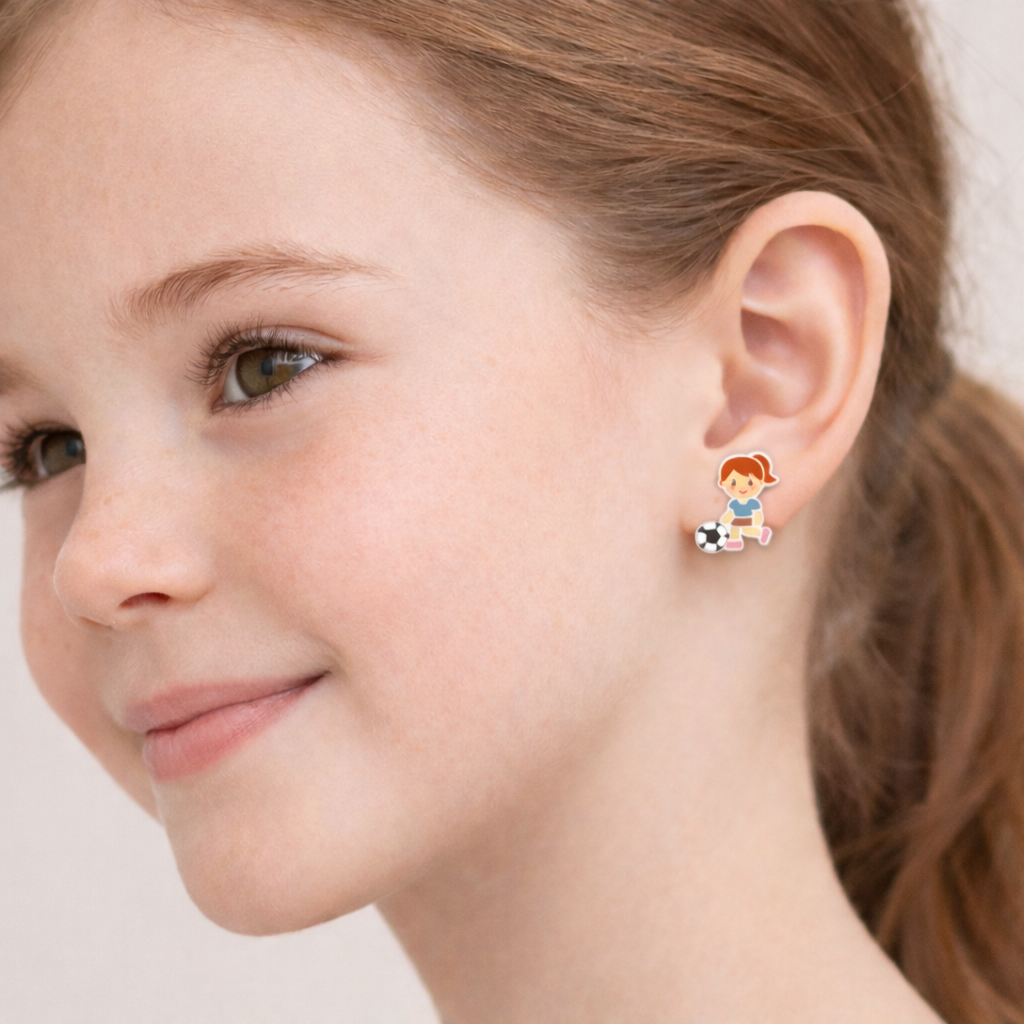 Melchior Jewellery girls football stud earrings worn by child with red hair and green eyes