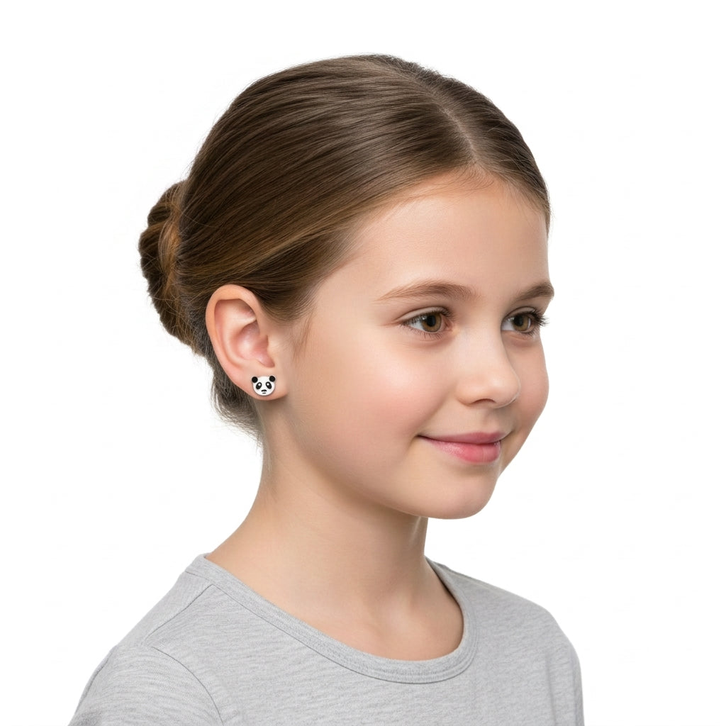 Young girl wearing Melchior Jewellery Girls Panda Earrings featuring cute black and white panda faces