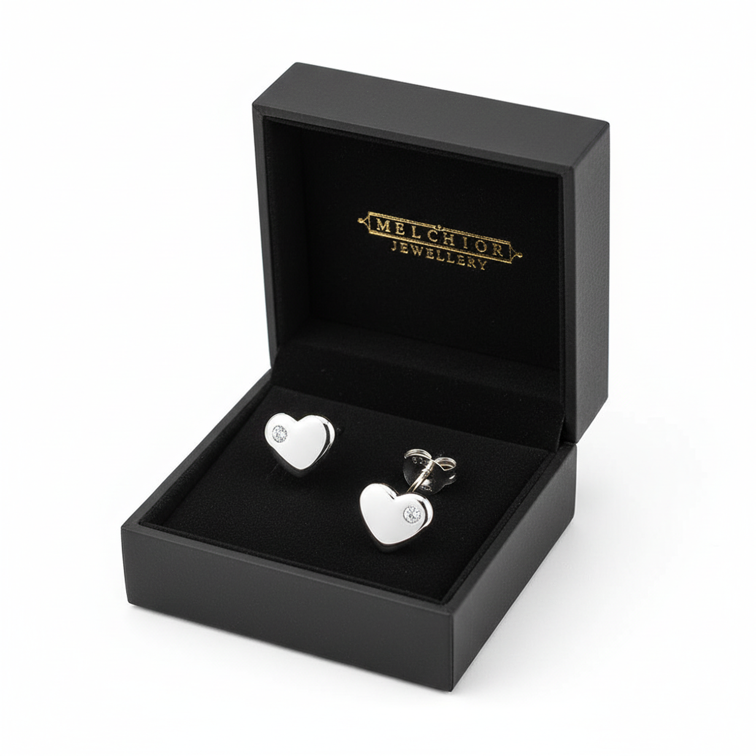 Girls sterling silver heart stud earrings with small clear stones in black Melchior Jewellery box