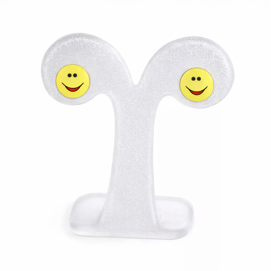 Yellow Happy Face Ear Studs for children by Melchior Jewellery, featuring smiley faces with black eyes and a red mouth