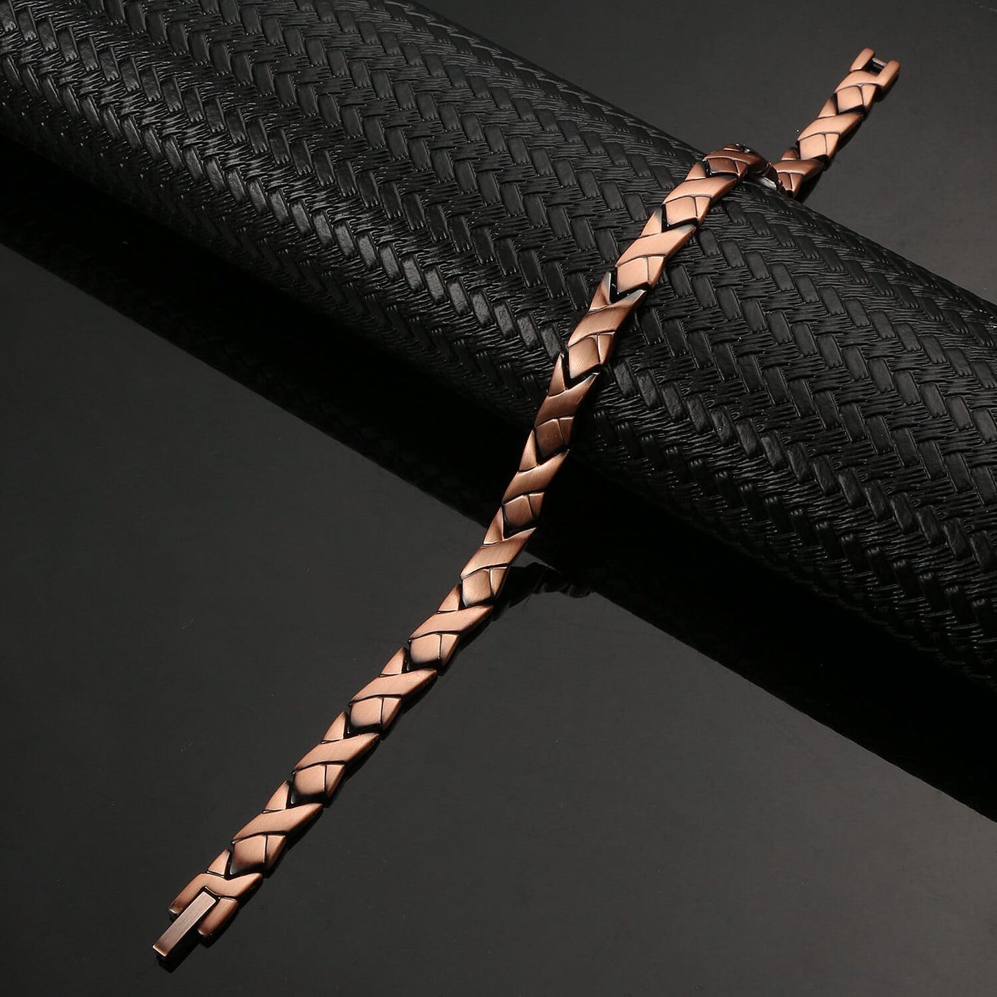 Melchior Jewellery ladies copper magnetic bracelet with braided rose copper links on black display
