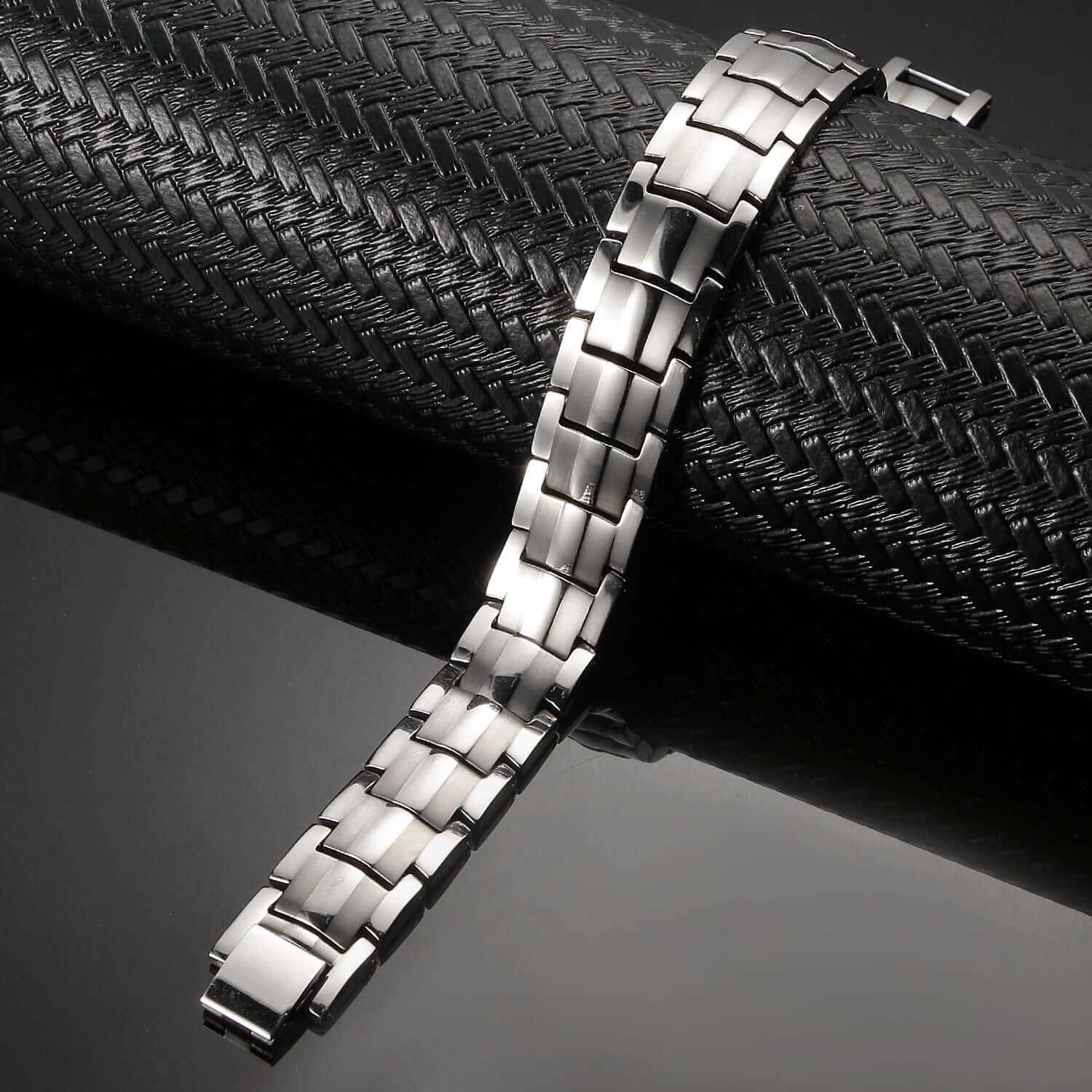 Melchior Jewellery silver titanium magnetic bracelet with brushed and polished links on black display