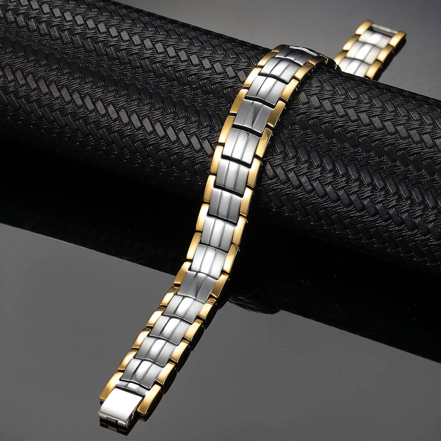 Melchior Jewellery two tone bracelet with gold edges and silver links on black background titanium magnetic bracelet pain relief