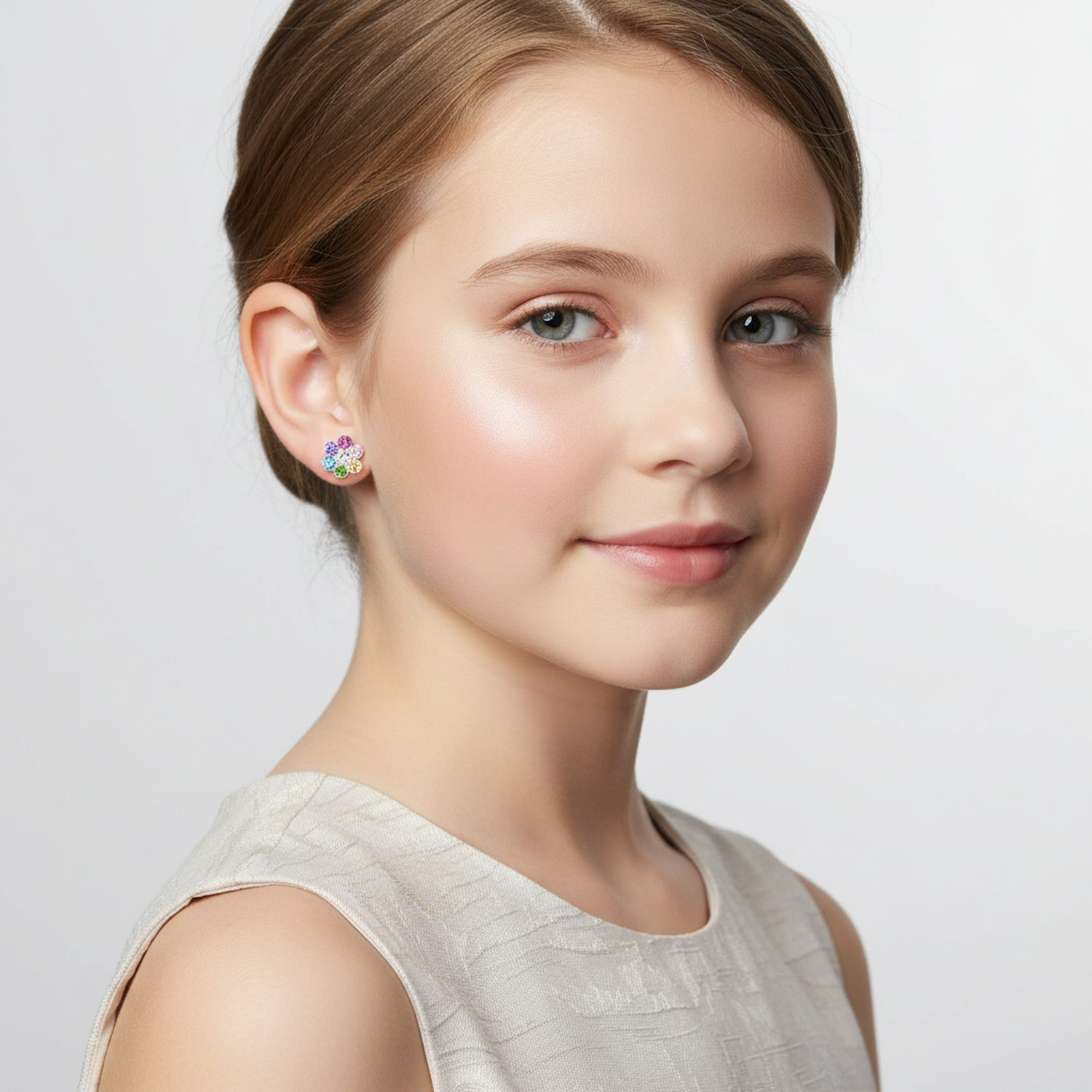 Young girl wearing Melchior Jewellery kids CZ screw back earrings with colourful cubic zirconia stones