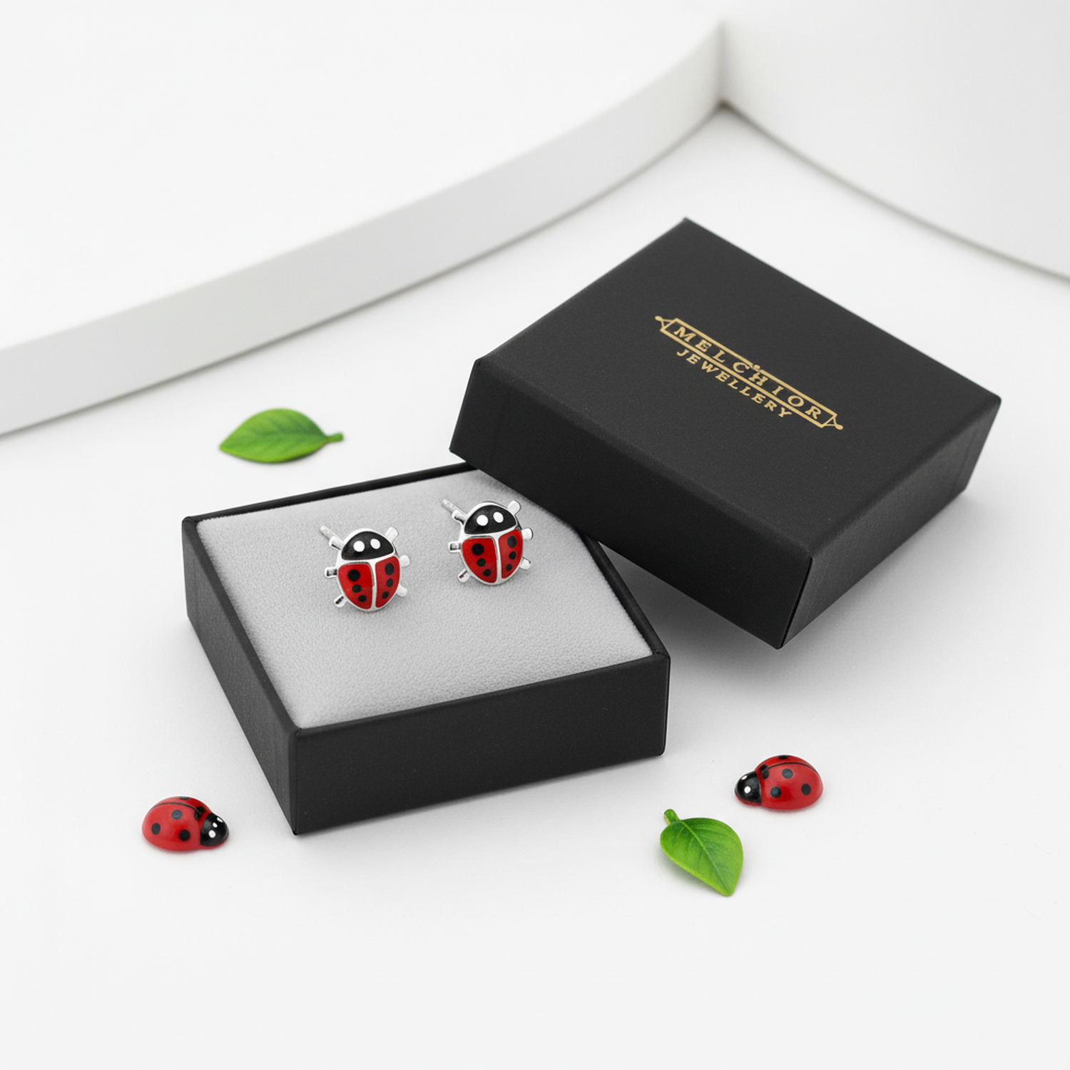Melchior Jewellery kids hypoallergenic ladybird studs in black gift box with ladybird decorations