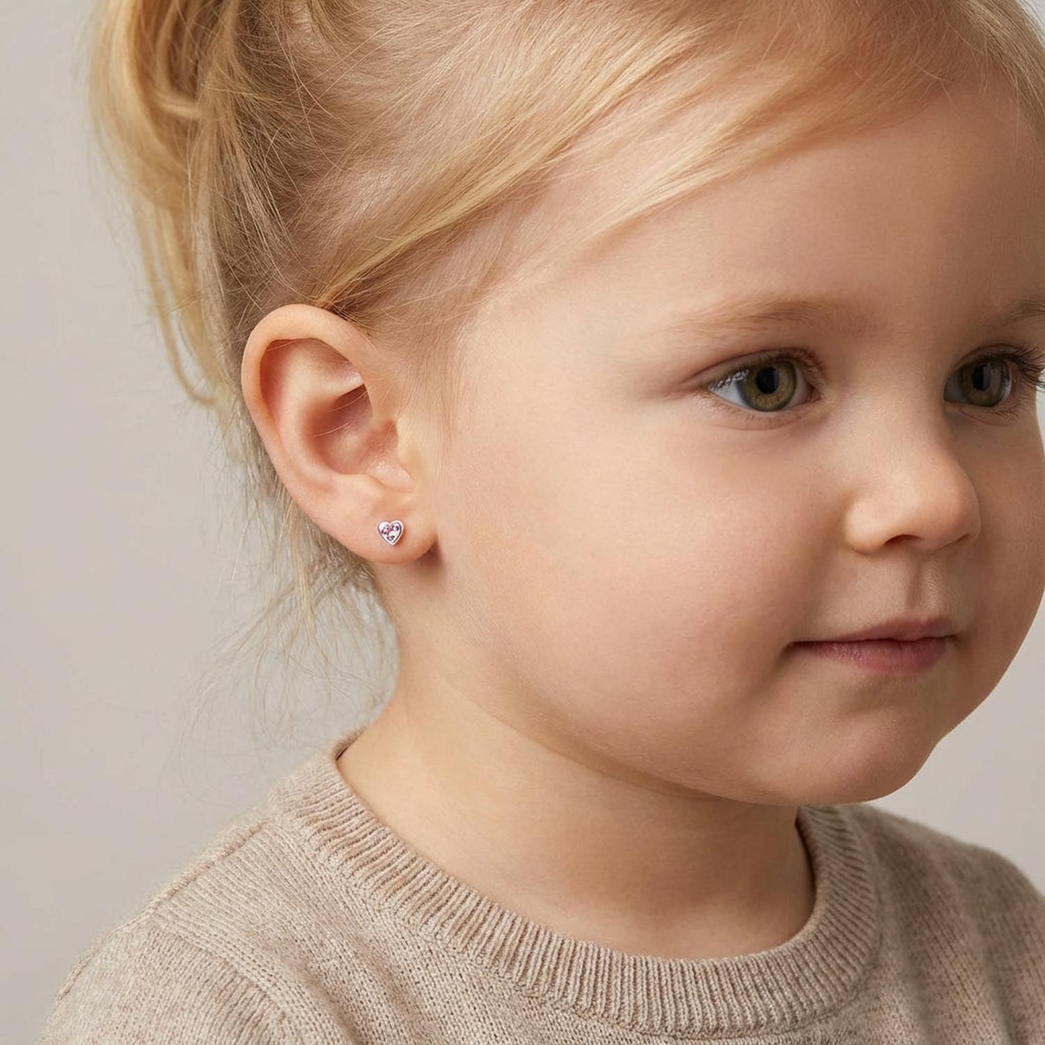 Melchior Jewellery kids pink crystal stud earrings worn by young child with blonde hair