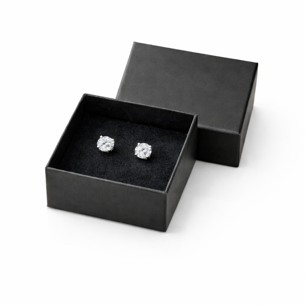 Melchior Jewellery kids screw back silver stud earrings displayed in black gift box