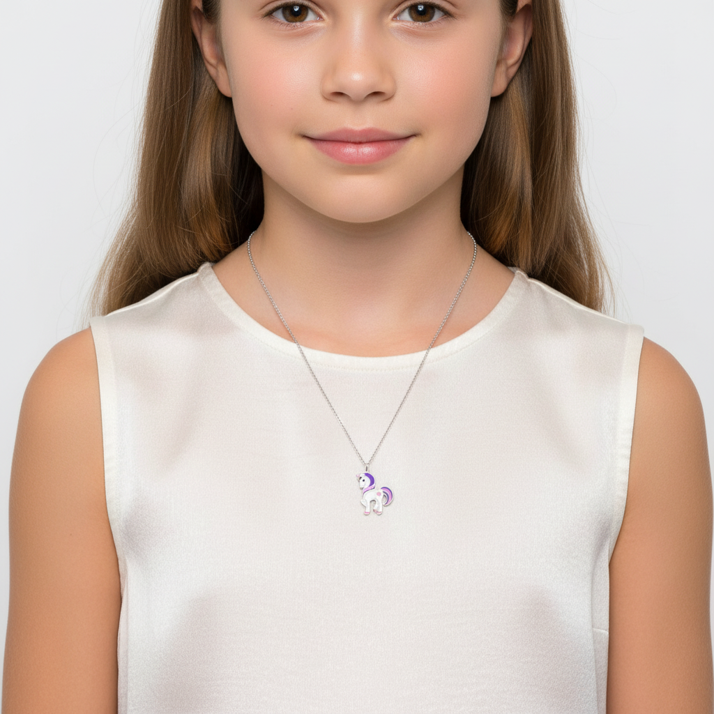Melchior Jewellery kids unicorn pendant silver necklace worn by child with long hair and white top