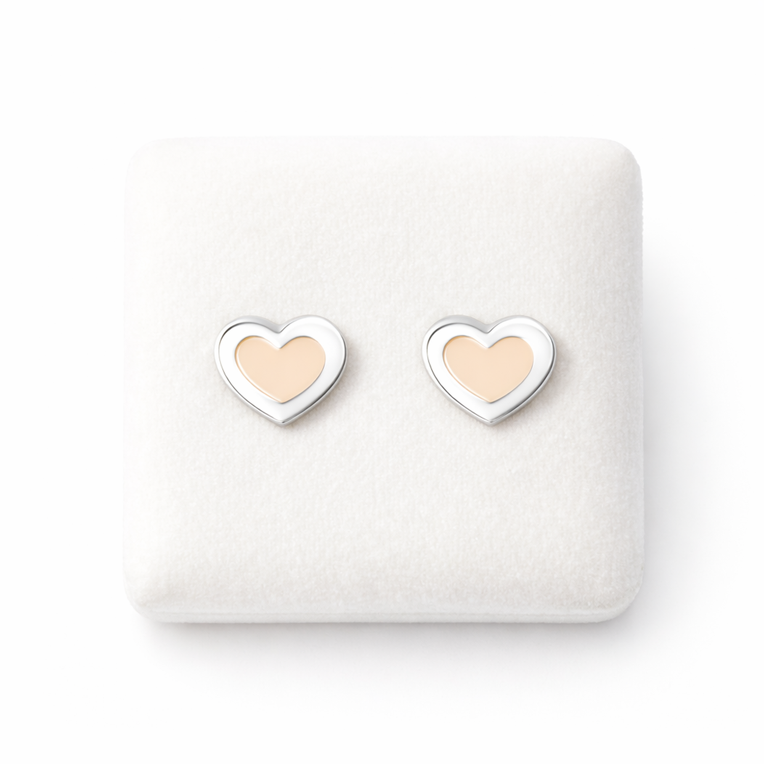 Pink heart stud earrings for girls by Melchior Jewellery in silver and pink on white display
