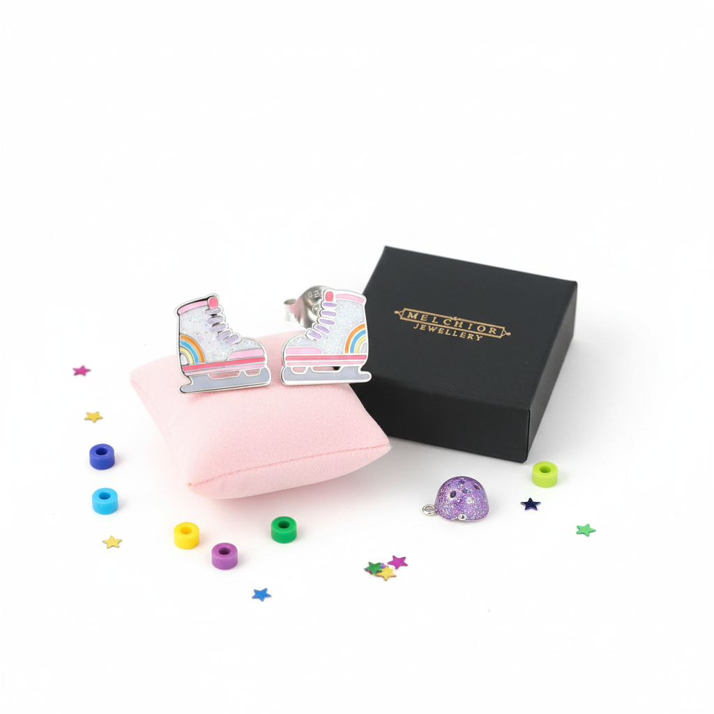 Silver roller skate earrings for girls by Melchior Jewellery displayed with gift box and colourful decorations