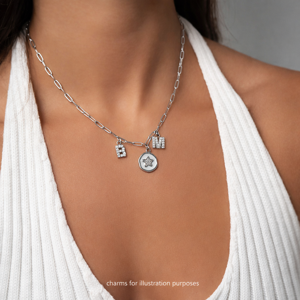 Melchior Jewellery silver Steel Paperclip Chain Necklace with star and initial charms worn with white ribbed top