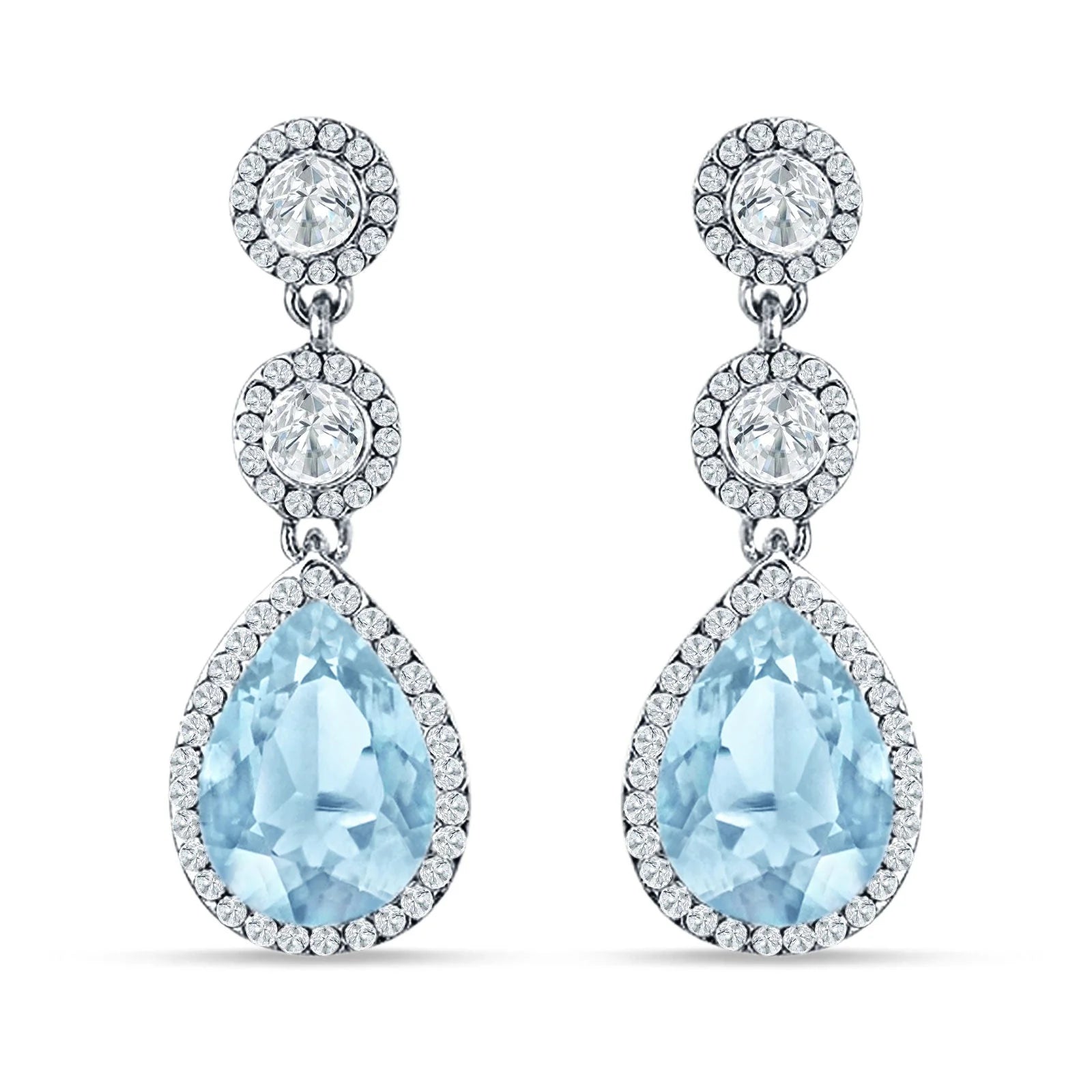 Sterling Silver Aquamarine Halo Drop Earrings by Melchior Jewellery featuring pear-shaped blue stones with crystal halo